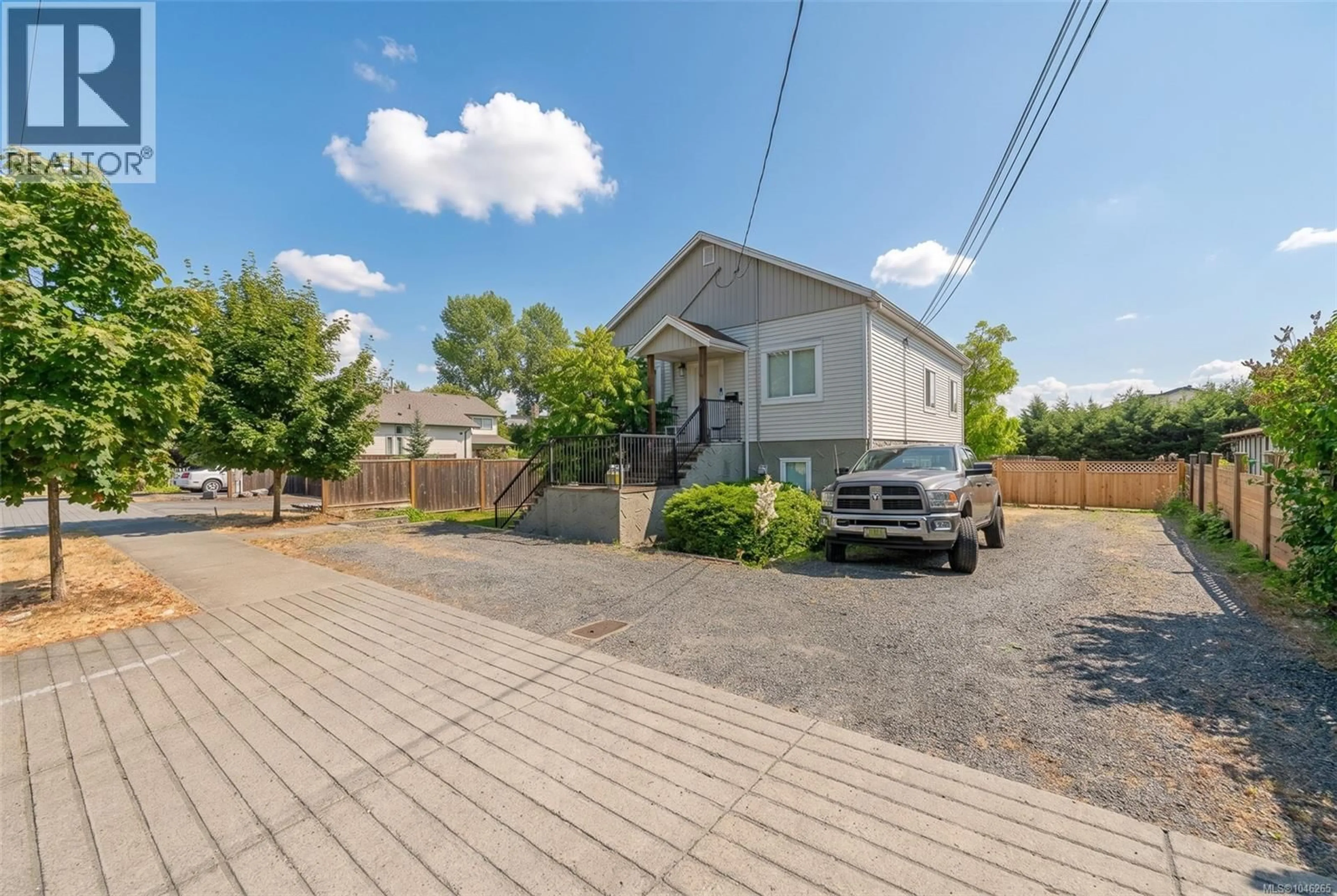 A pic from outside/outdoor area/front of a property/back of a property/a pic from drone, street for 121 HAREWOOD ROAD, Nanaimo British Columbia V9R2Y7