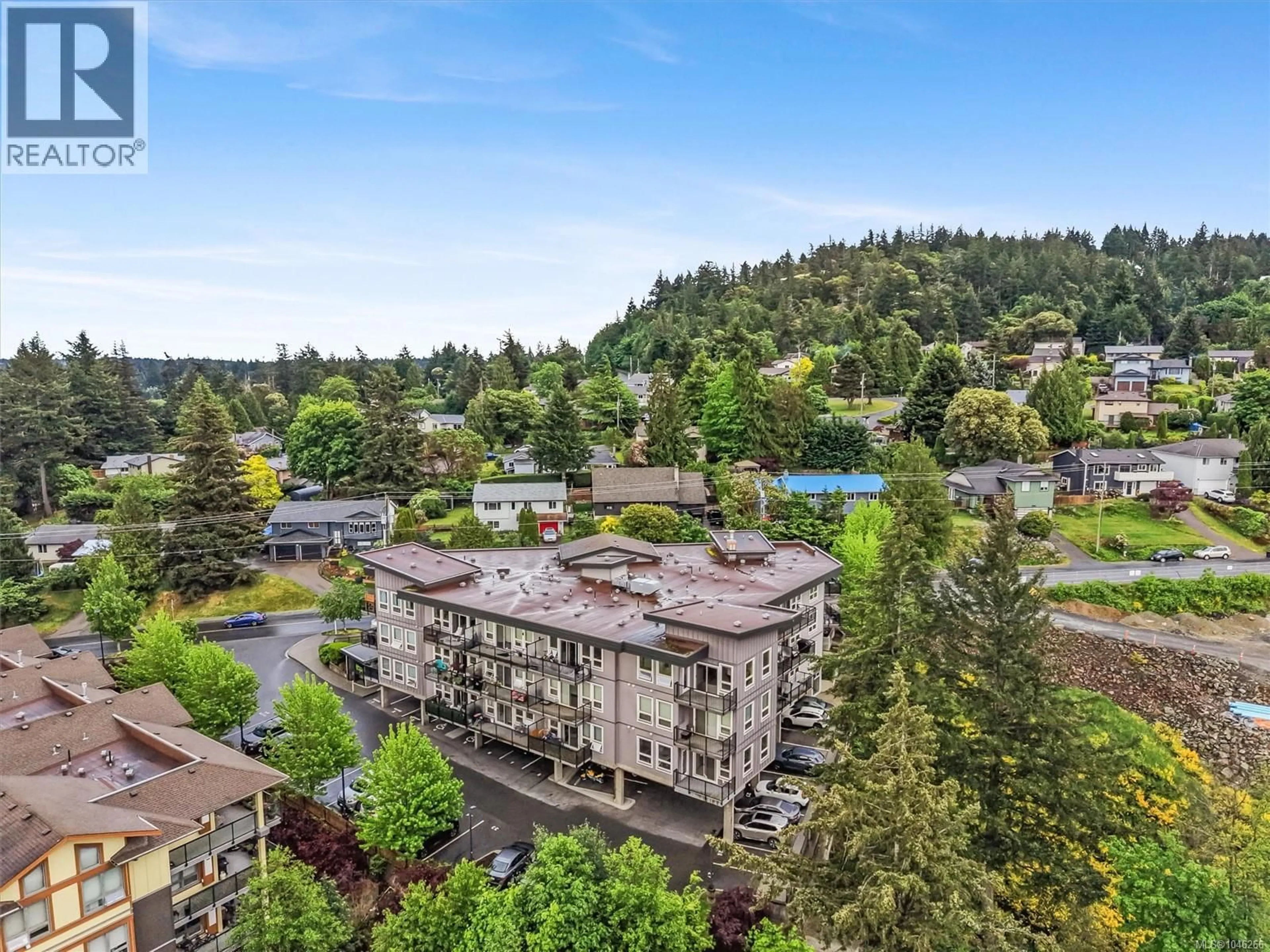 A pic from outside/outdoor area/front of a property/back of a property/a pic from drone, mountain view for 410 - 3240 JACKLIN ROAD, Langford British Columbia V9B0J5