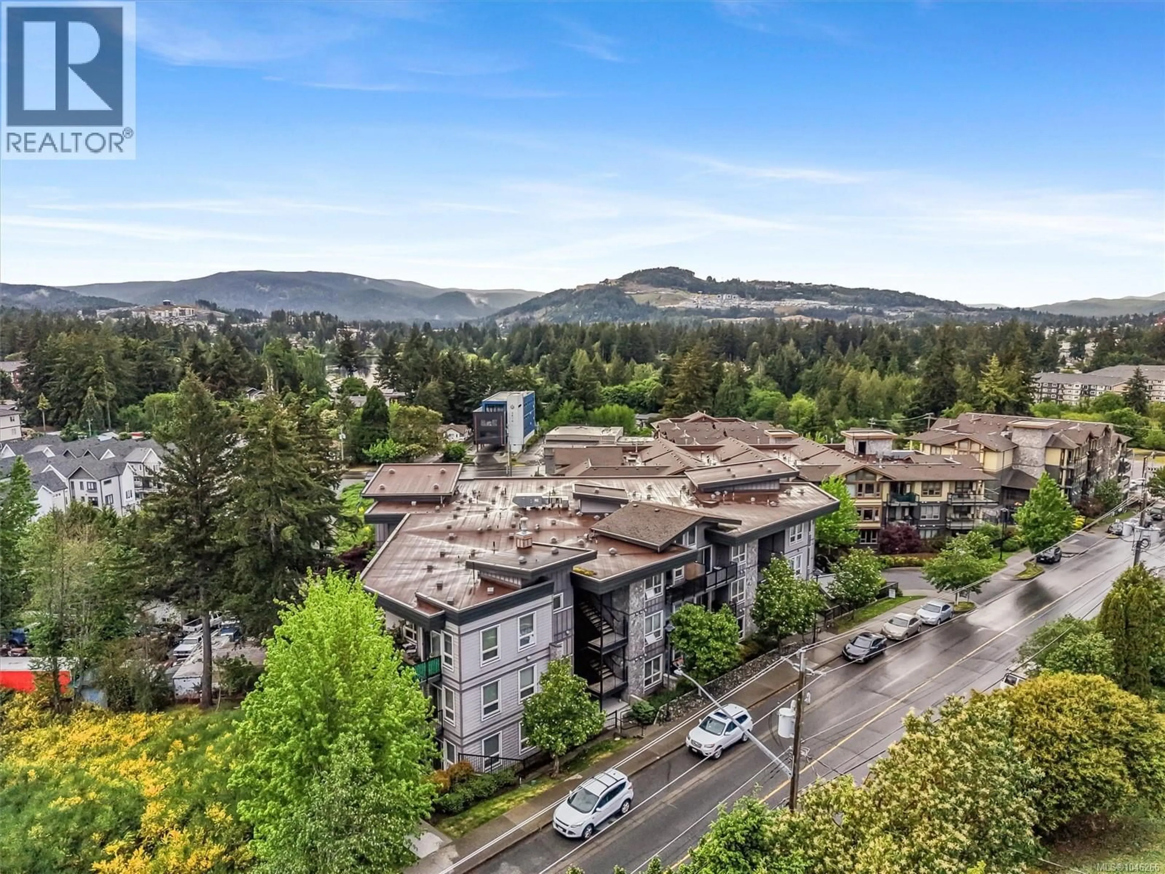 A pic from outside/outdoor area/front of a property/back of a property/a pic from drone, mountain view for 410 - 3240 JACKLIN ROAD, Langford British Columbia V9B0J5
