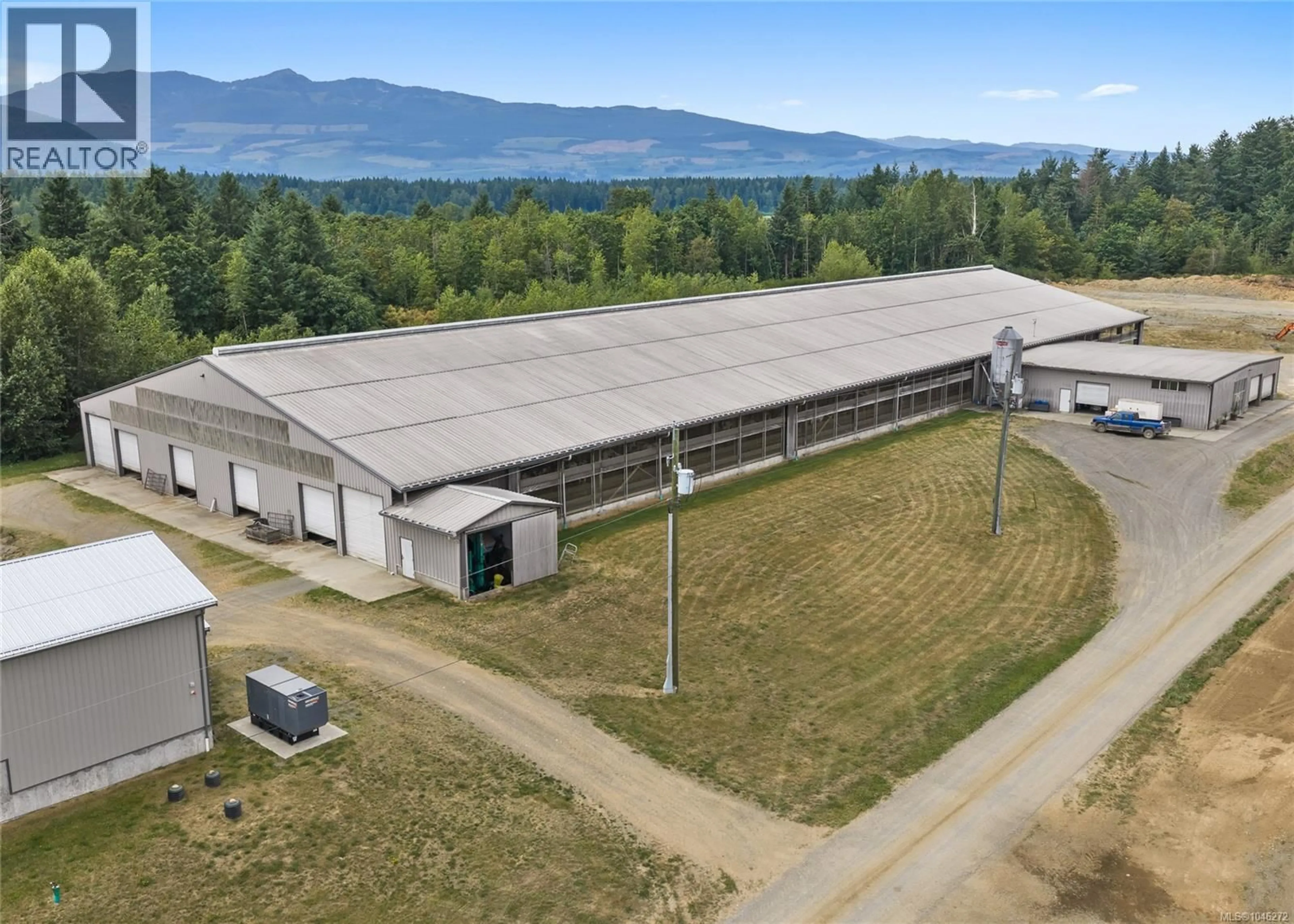 A pic from outside/outdoor area/front of a property/back of a property/a pic from drone, building for 2400 PLOYART ROAD, Black Creek British Columbia V9J1H8