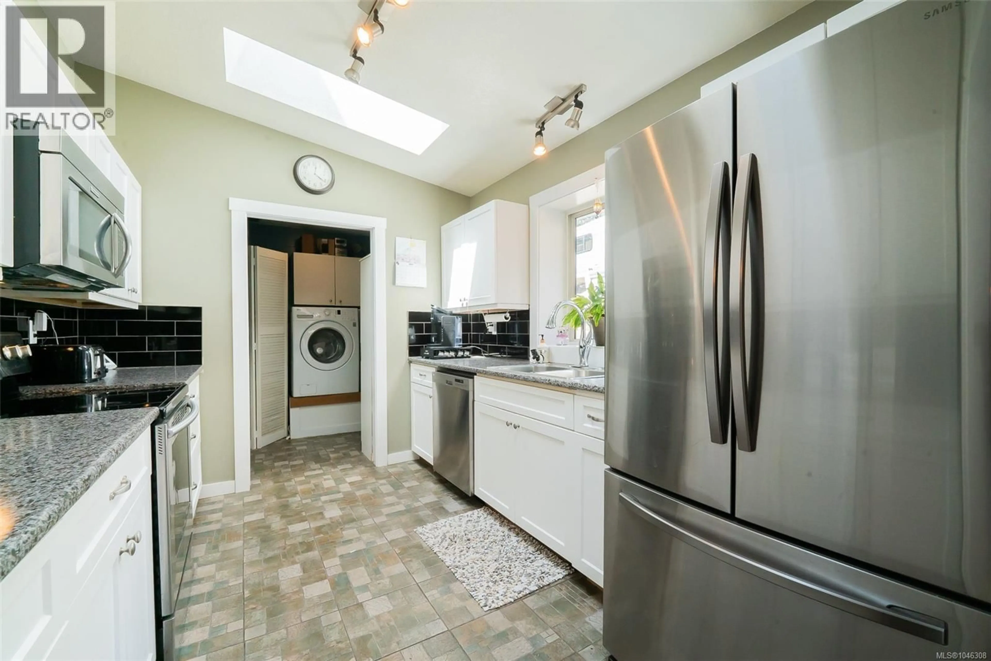 Kitchen with laundary machines, ceramic/tile floor for 2446 DIVOT DRIVE, Nanaimo British Columbia V9T4B2