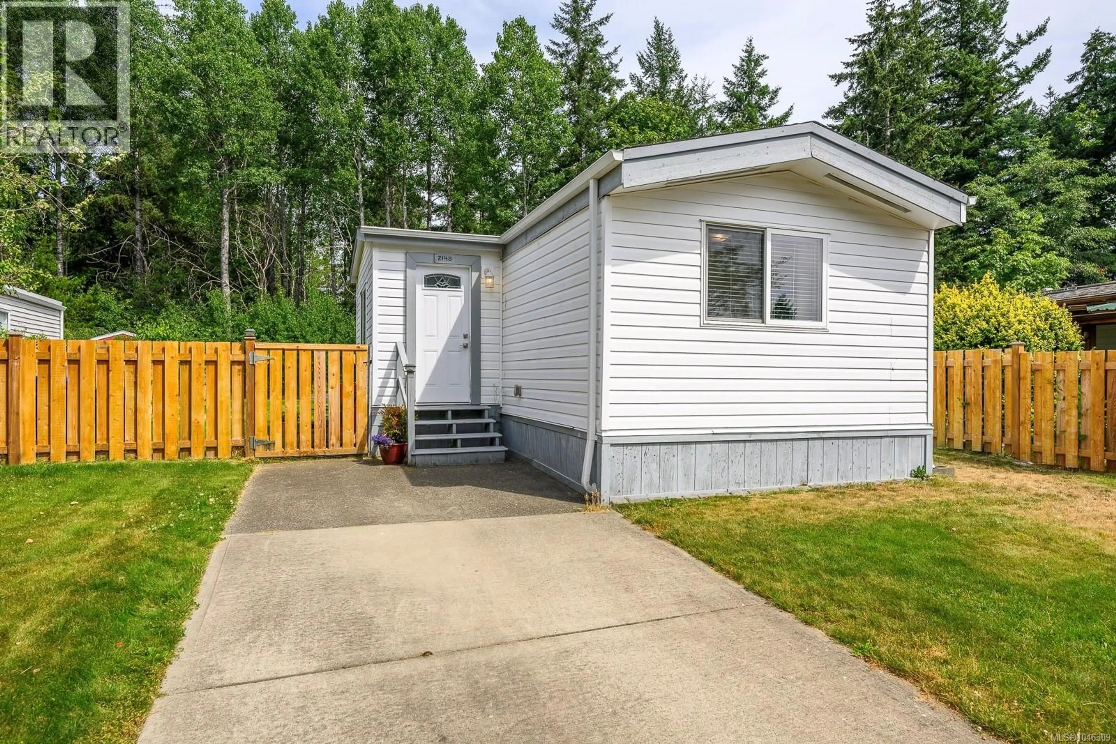 Home with vinyl exterior material, street for 2140 STADACONA DRIVE, Comox British Columbia V9M3P7