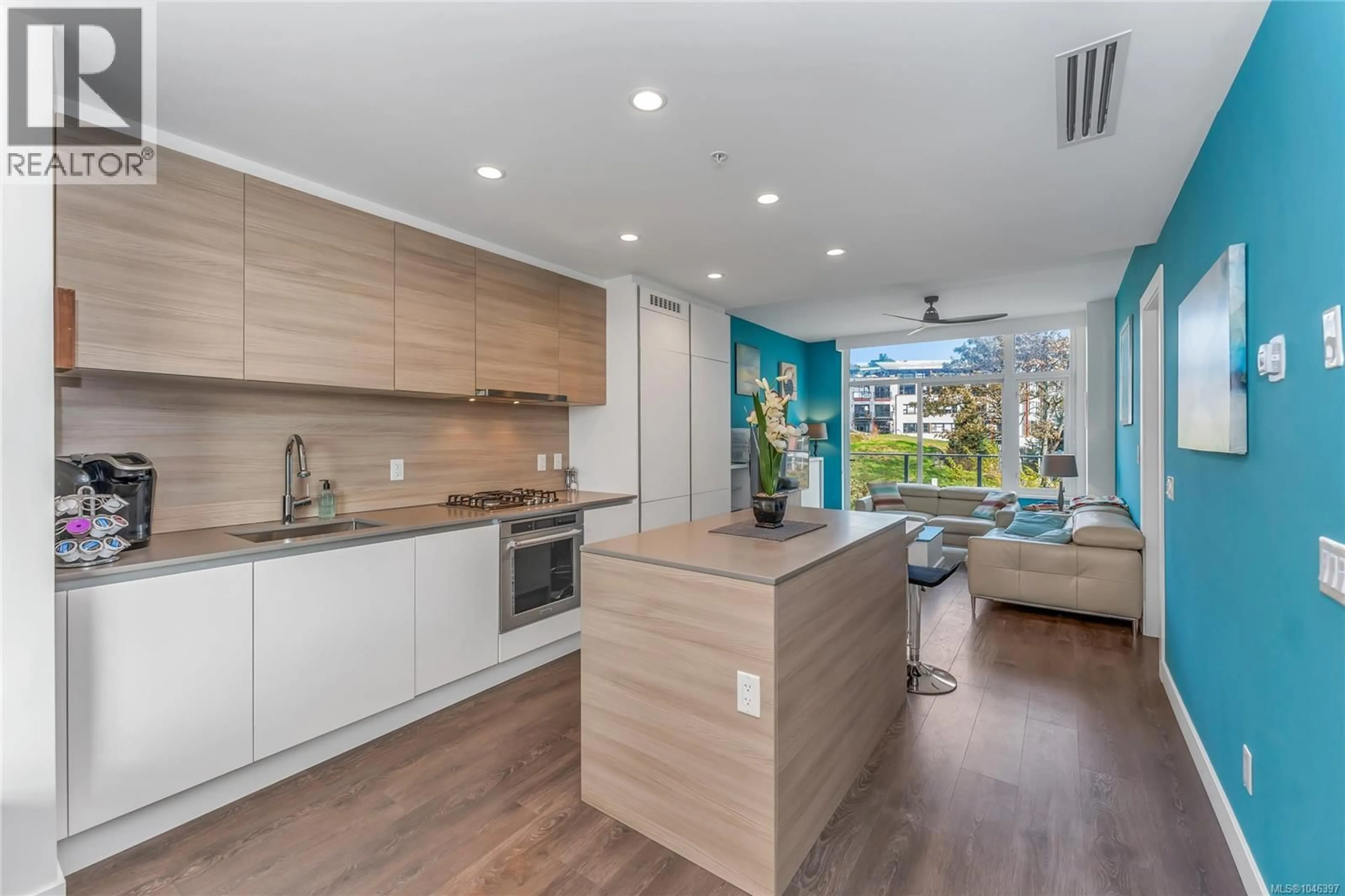 Open concept kitchen, wood/laminate floor for 211 - 70 SAGHALIE ROAD, Victoria British Columbia V9A0G9