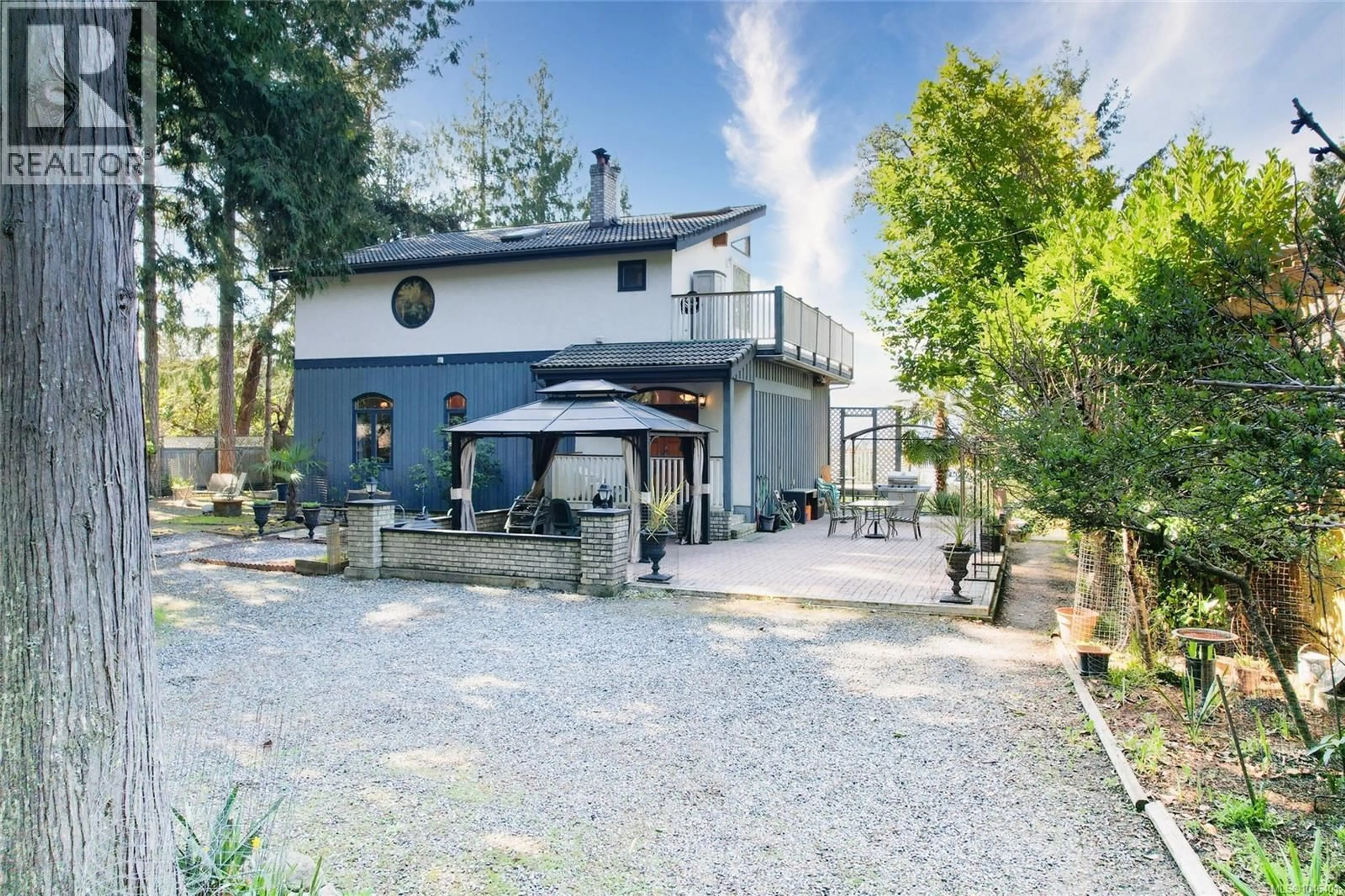 A pic from outside/outdoor area/front of a property/back of a property/a pic from drone, street for 1059 PAT BURNS AVENUE, Gabriola Island British Columbia V0R1X2