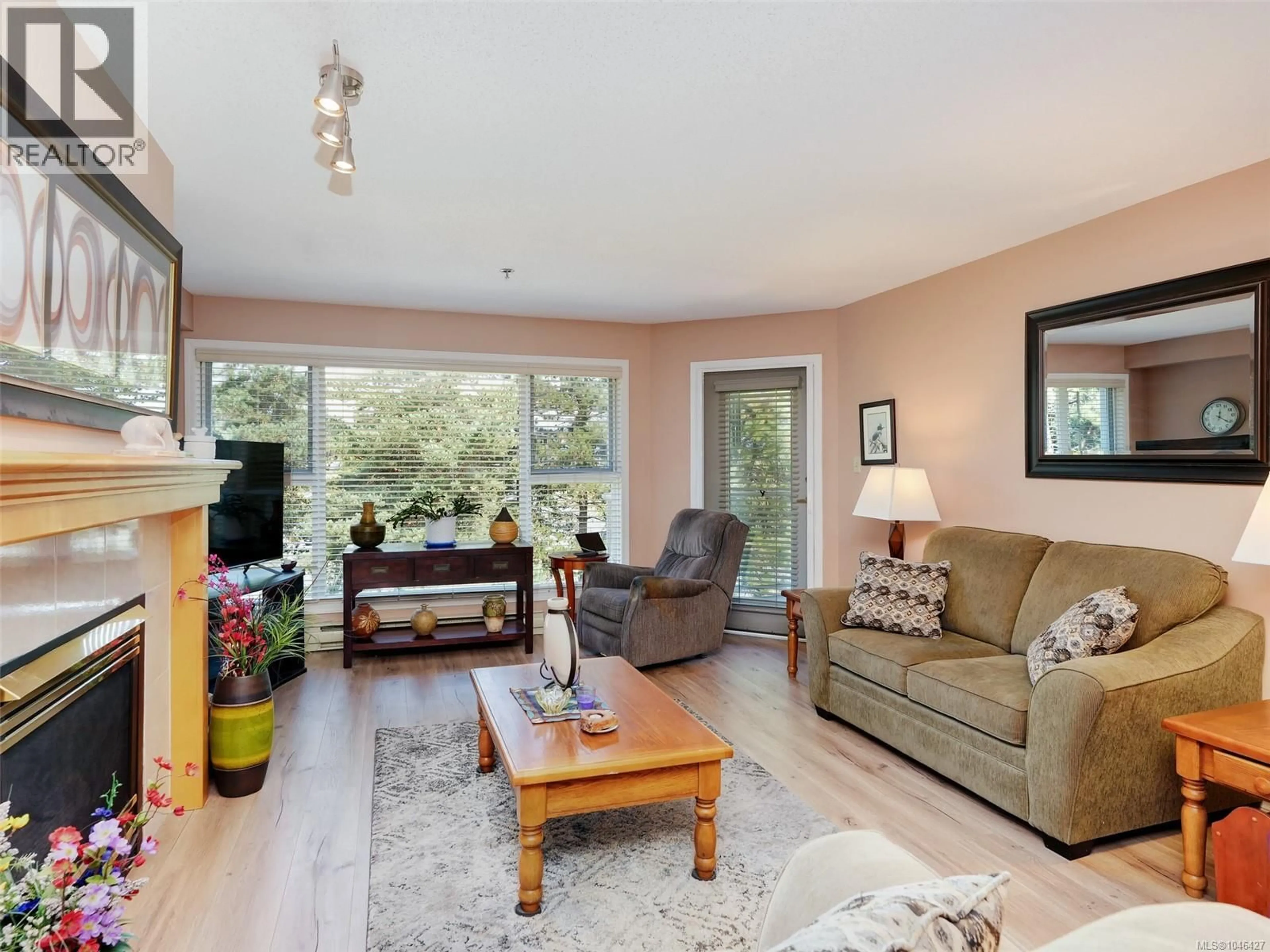 Living room with furniture, wood/laminate floor for 305 - 3009 BRITTANY DRIVE, Langford British Columbia V9B2N7