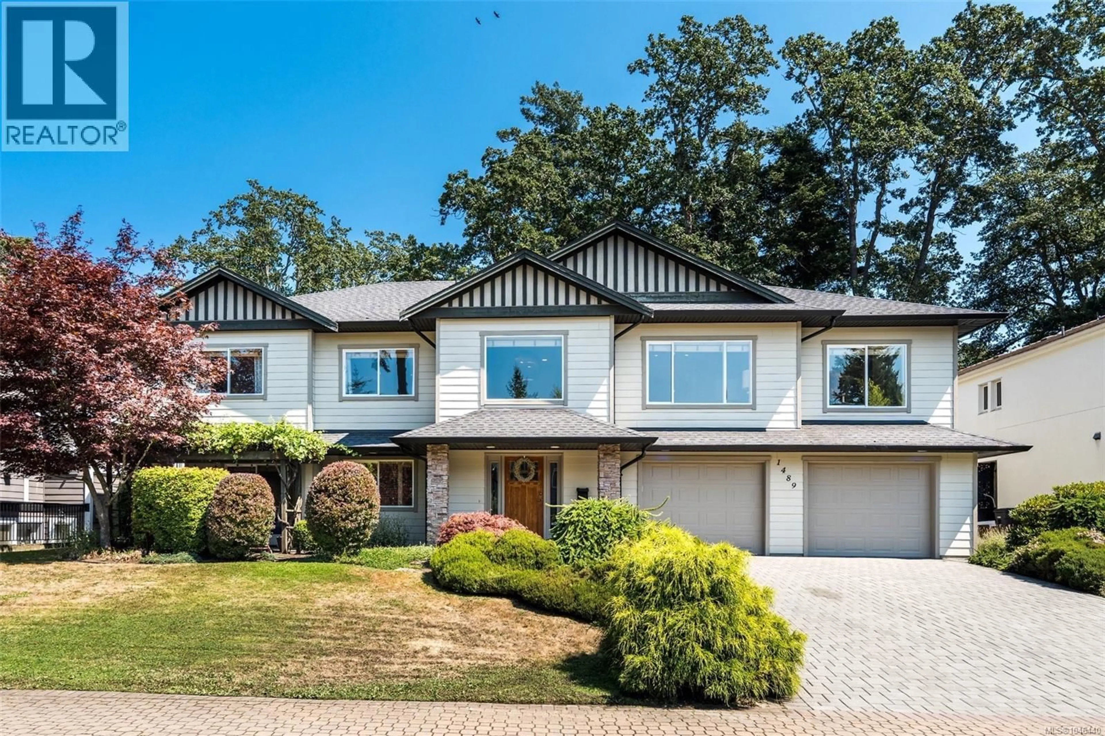 Home with vinyl exterior material, street for 1489 MT. DOUGLAS CROSS ROAD, Saanich British Columbia V8X3H6