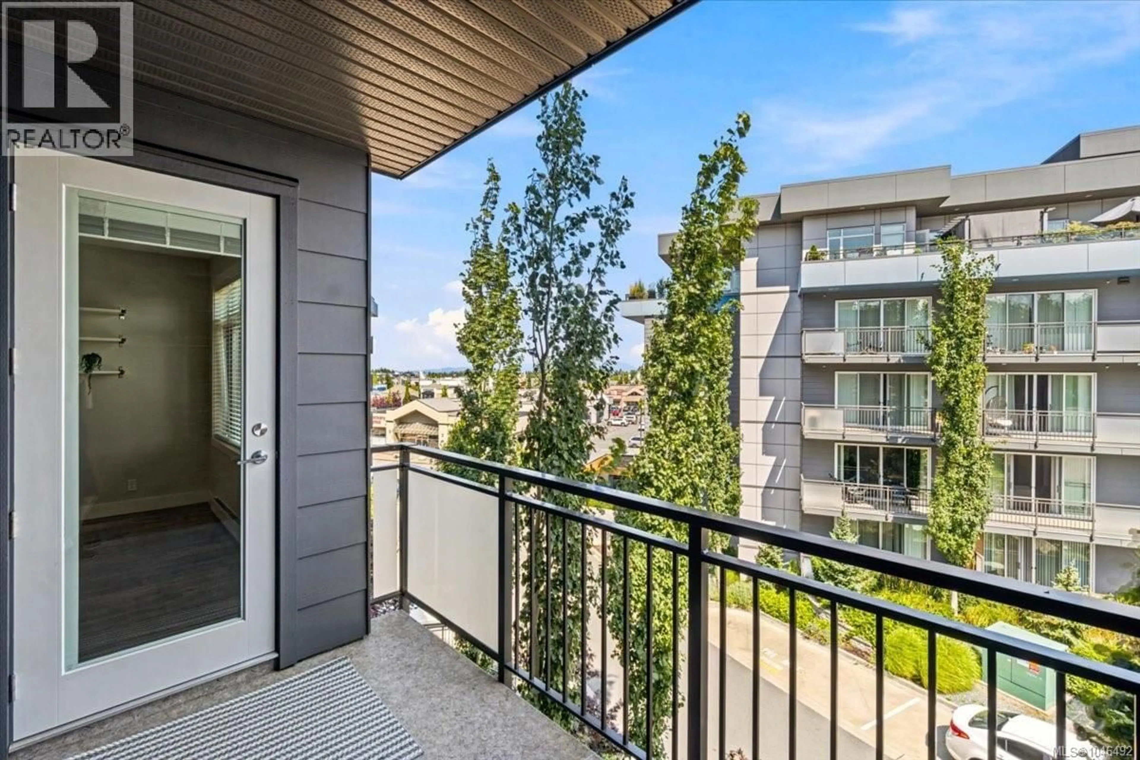 Balcony in the apartment, city buildings view from balcony for 313 - 6540 METRAL DRIVE, Nanaimo British Columbia V9T0L8