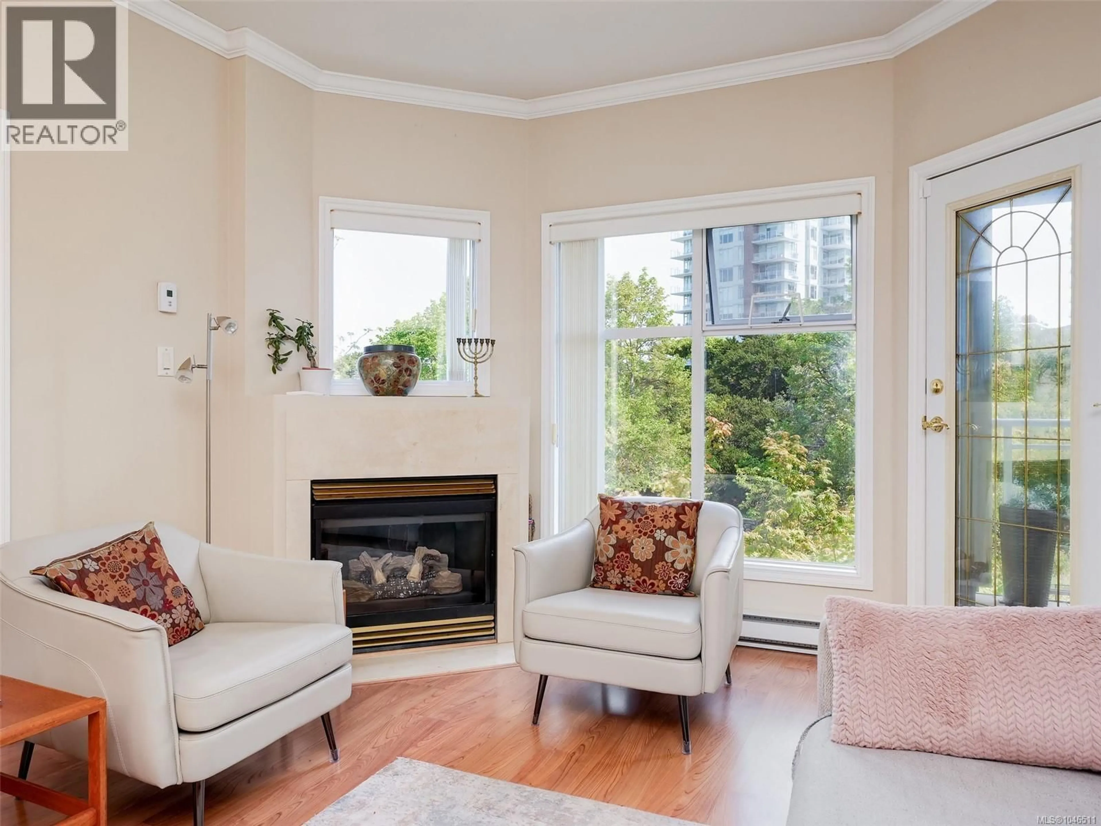 Living room with furniture, wood/laminate floor for 303 - 165 KIMTA ROAD, Victoria British Columbia V9A7P1