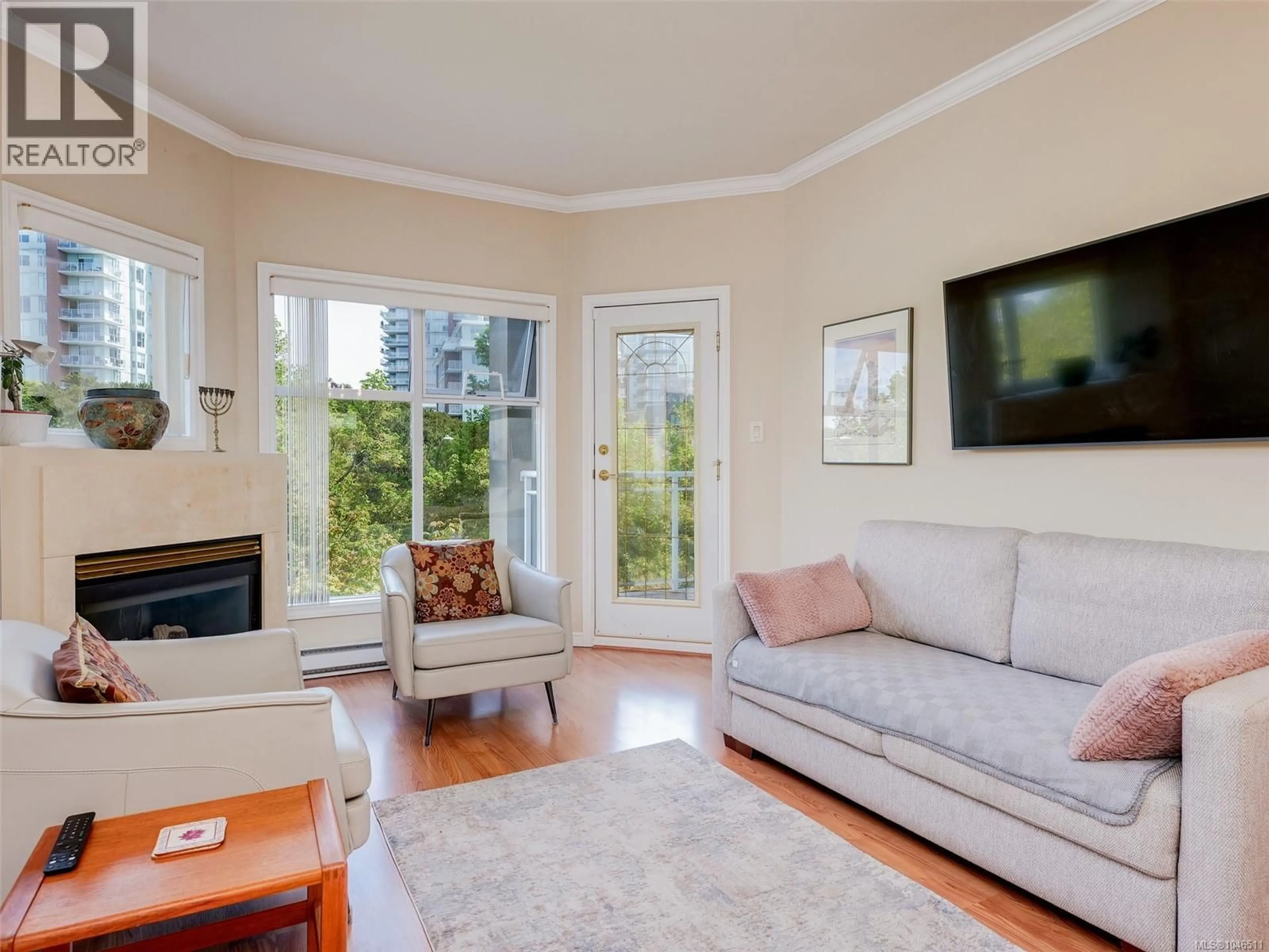 Living room with furniture, wood/laminate floor for 303 - 165 KIMTA ROAD, Victoria British Columbia V9A7P1