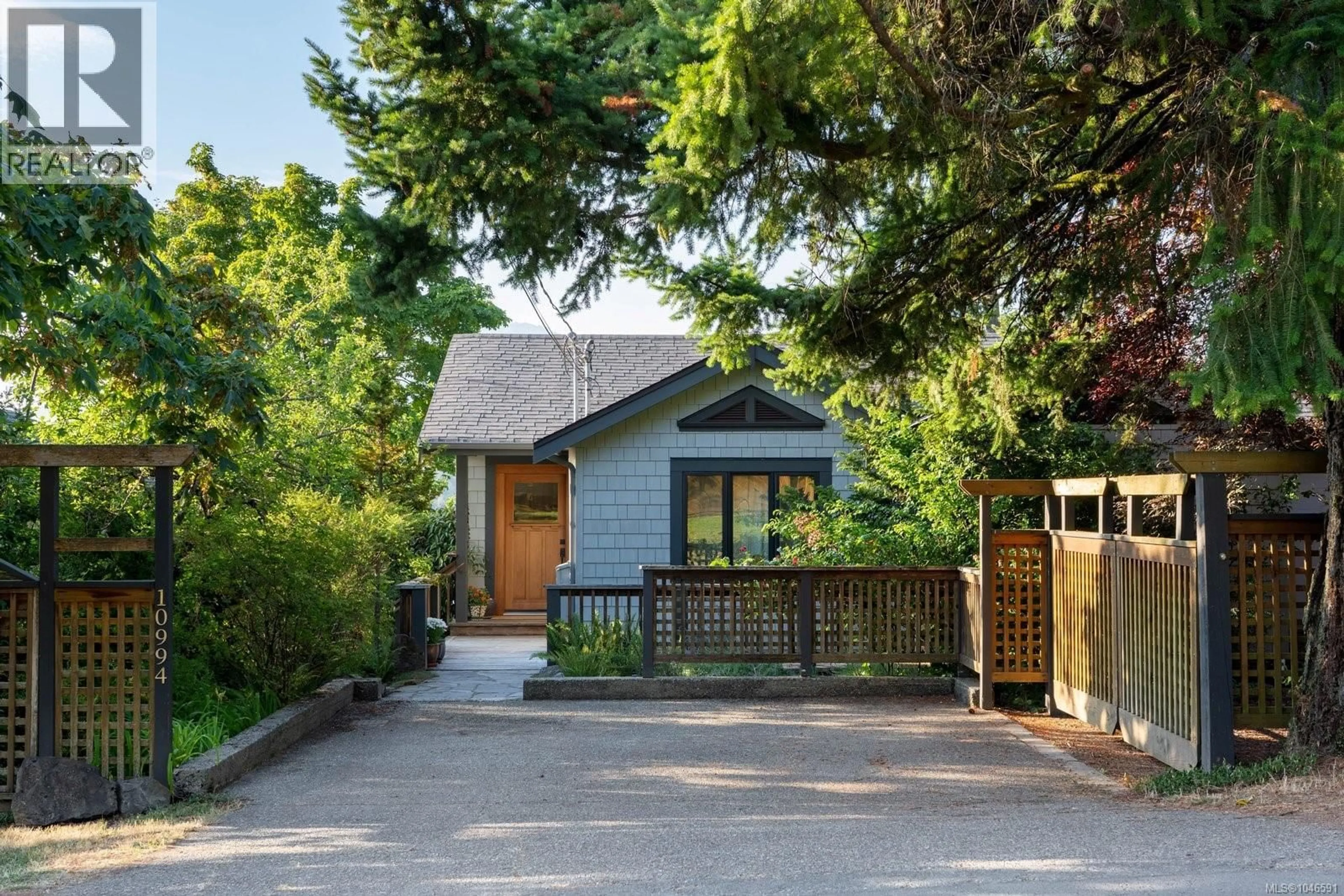 Home with brick exterior material, street for 10994 MADRONA DRIVE, North Saanich British Columbia V8L5R7