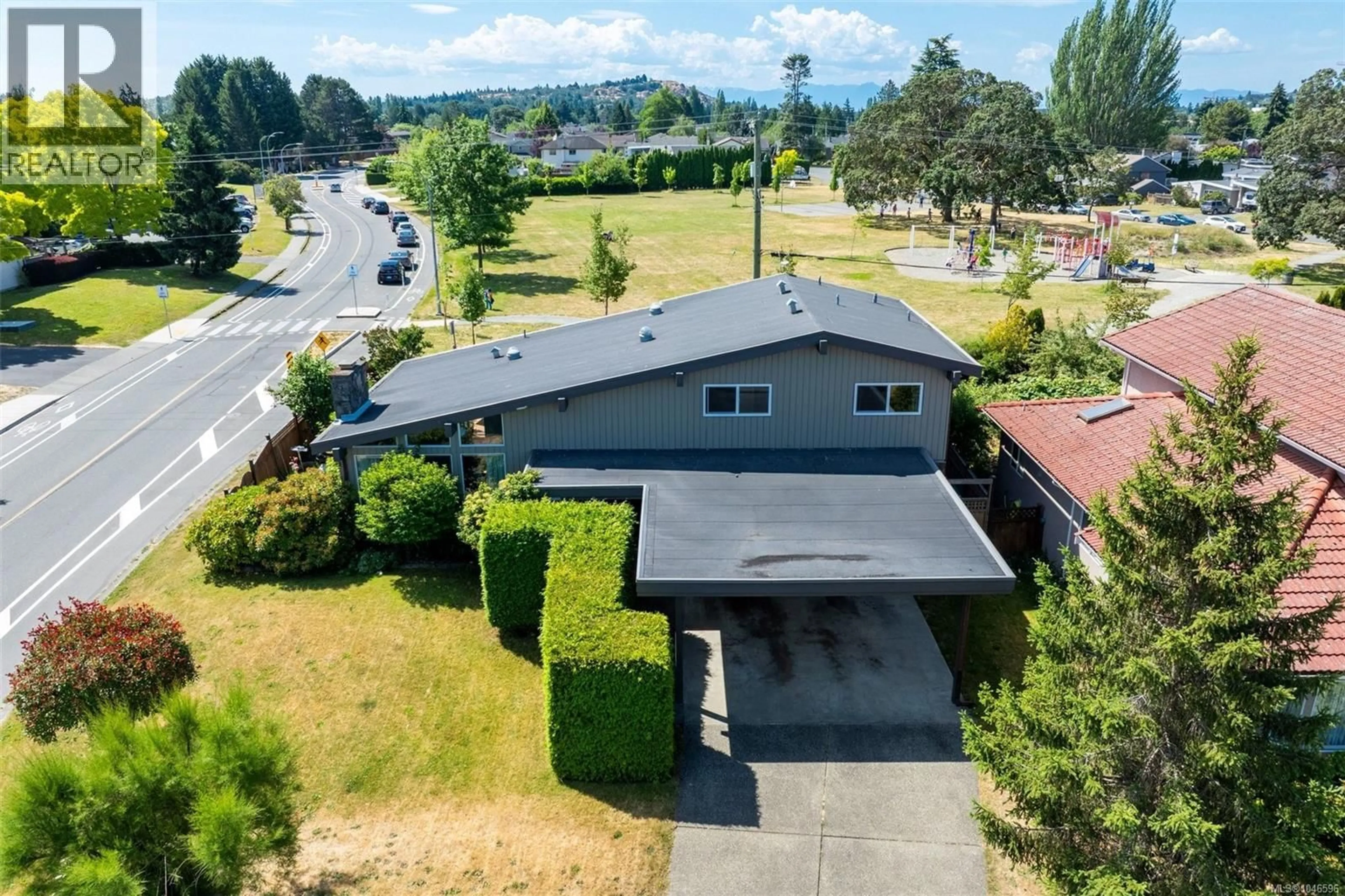 A pic from outside/outdoor area/front of a property/back of a property/a pic from drone, street for 4070 LARCHWOOD DRIVE, Saanich British Columbia V8N6H7