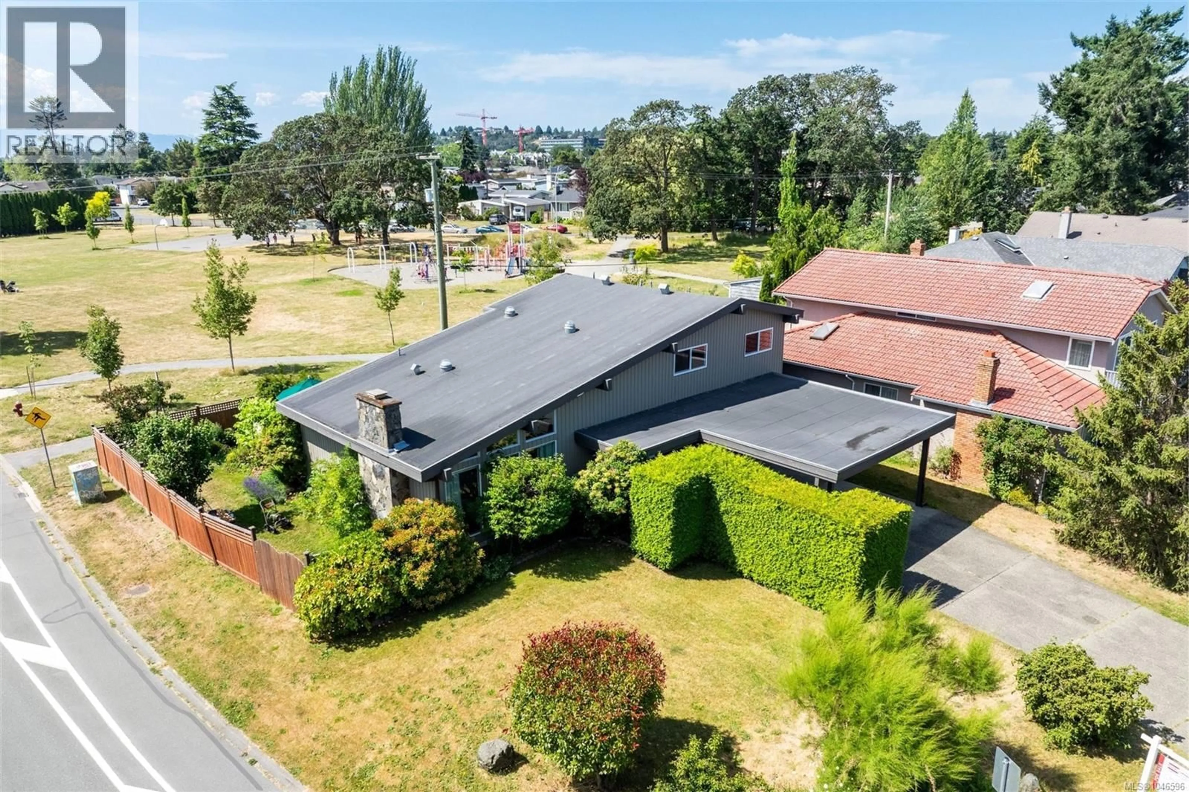 A pic from outside/outdoor area/front of a property/back of a property/a pic from drone, street for 4070 LARCHWOOD DRIVE, Saanich British Columbia V8N6H7