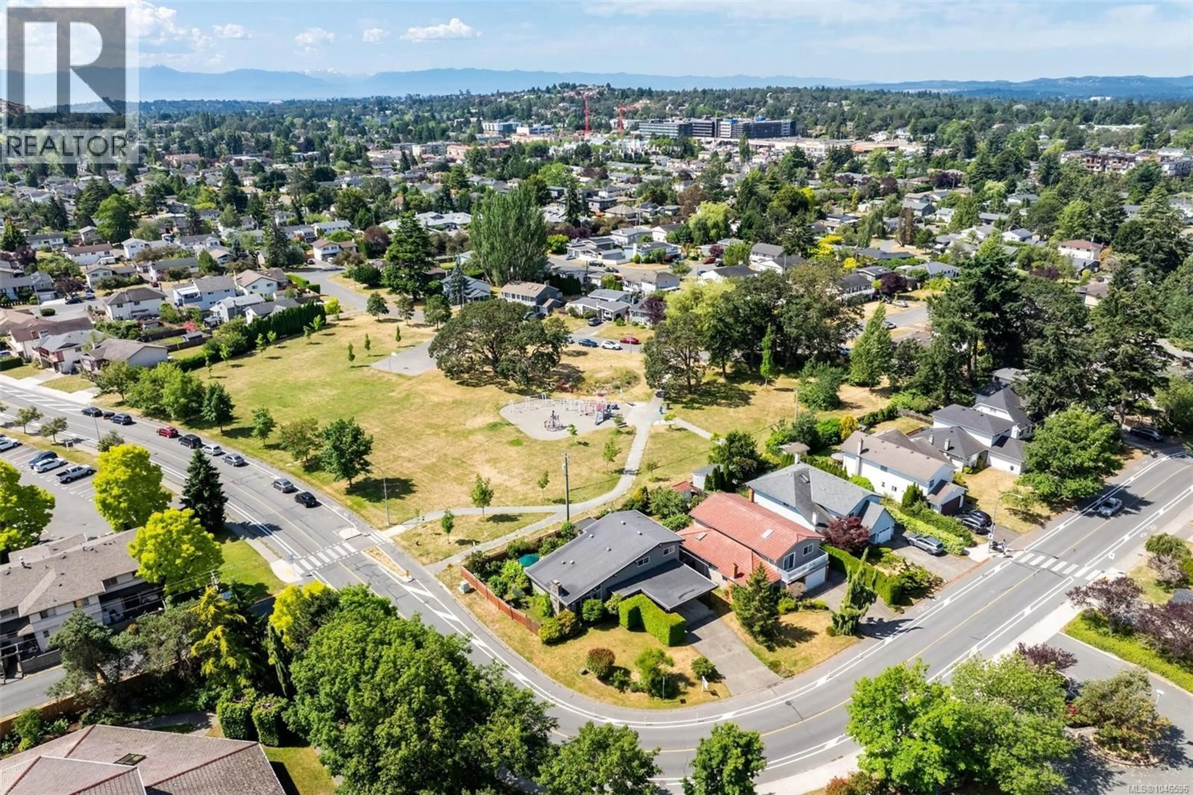 A pic from outside/outdoor area/front of a property/back of a property/a pic from drone, street for 4070 LARCHWOOD DRIVE, Saanich British Columbia V8N6H7