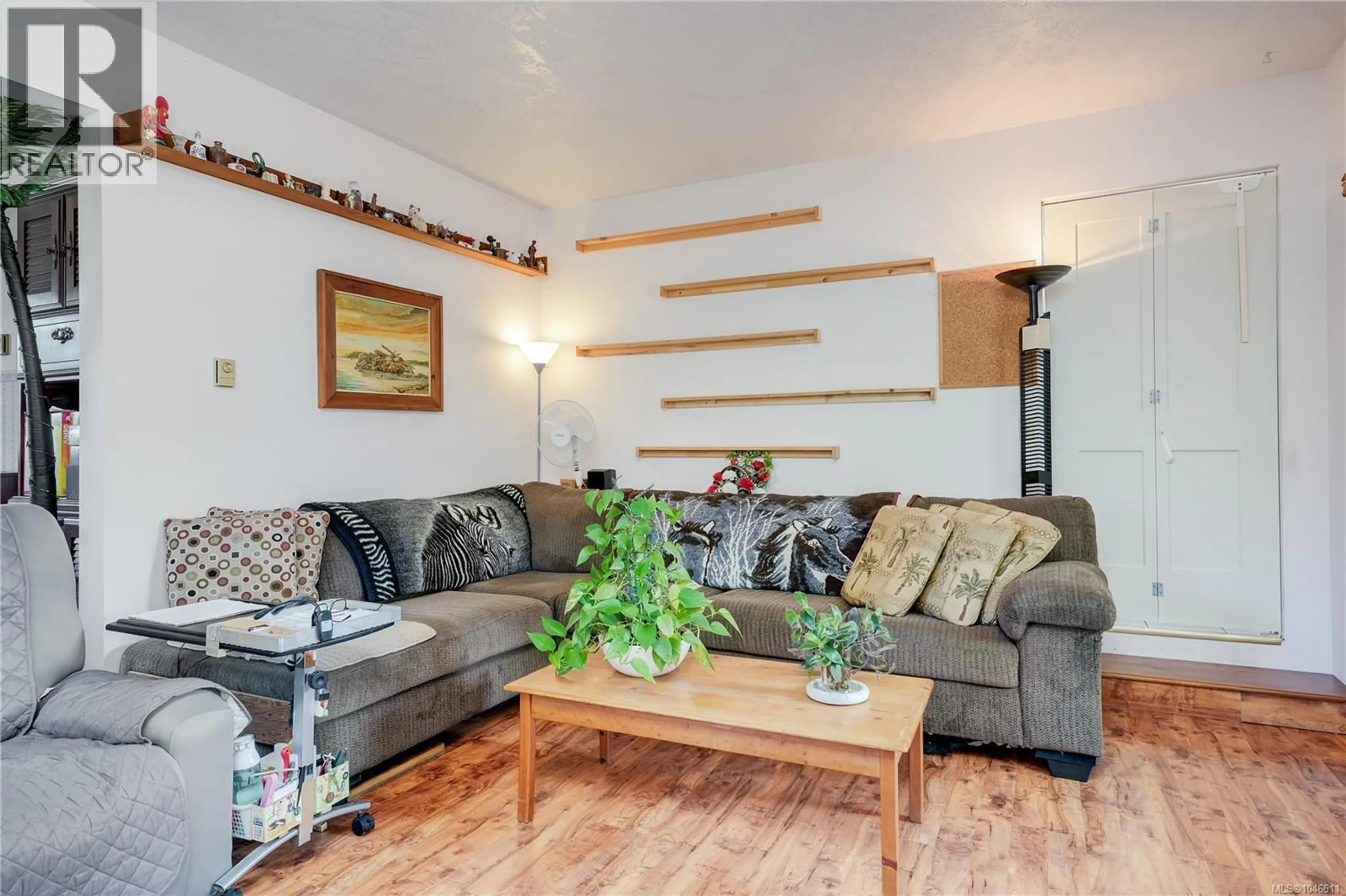 Living room with furniture, wood/laminate floor for 2227 FRENCH ROAD SOUTH, Sooke British Columbia V9Z1J5