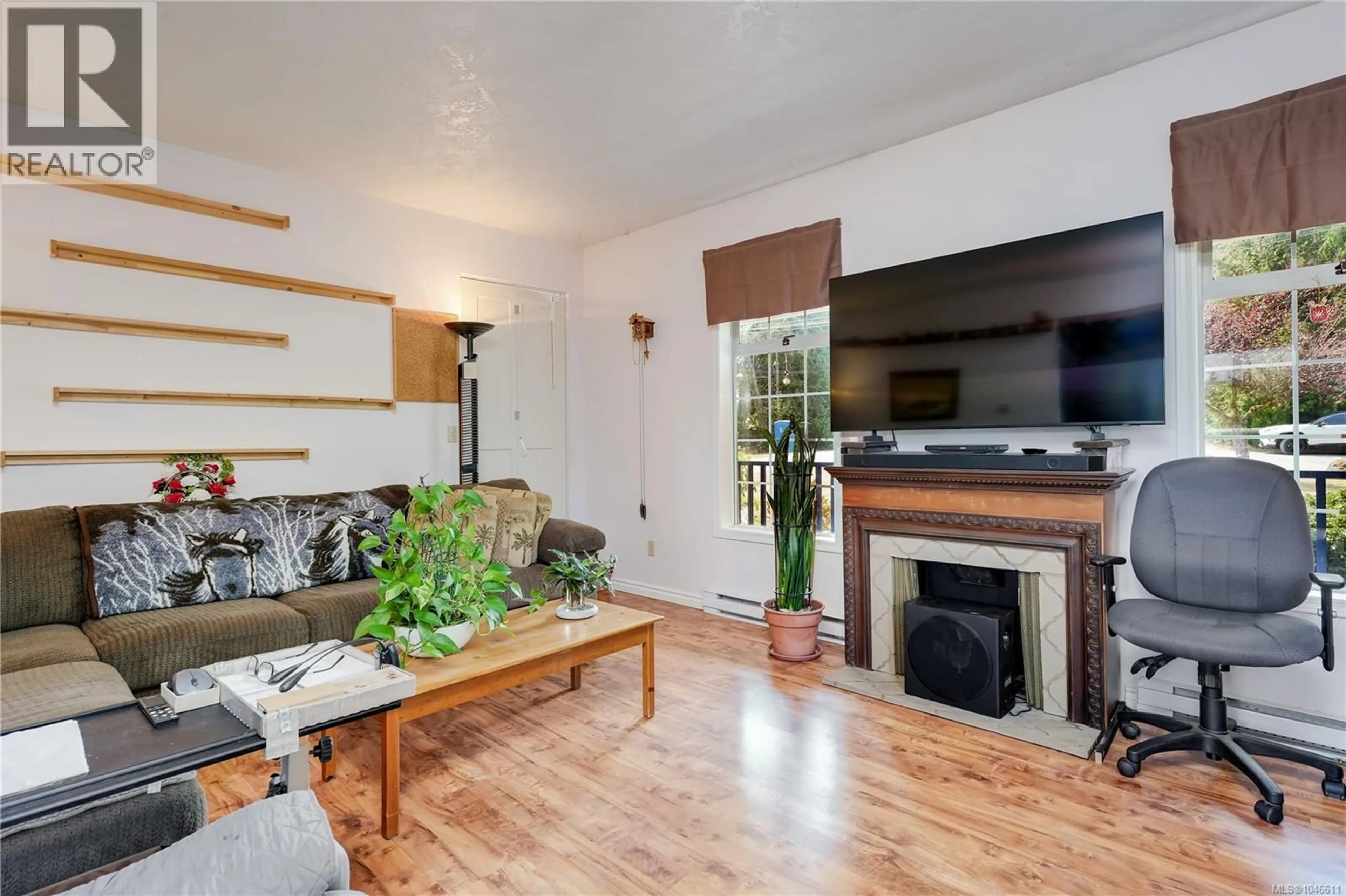 Living room with furniture, wood/laminate floor for 2227 FRENCH ROAD SOUTH, Sooke British Columbia V9Z1J5