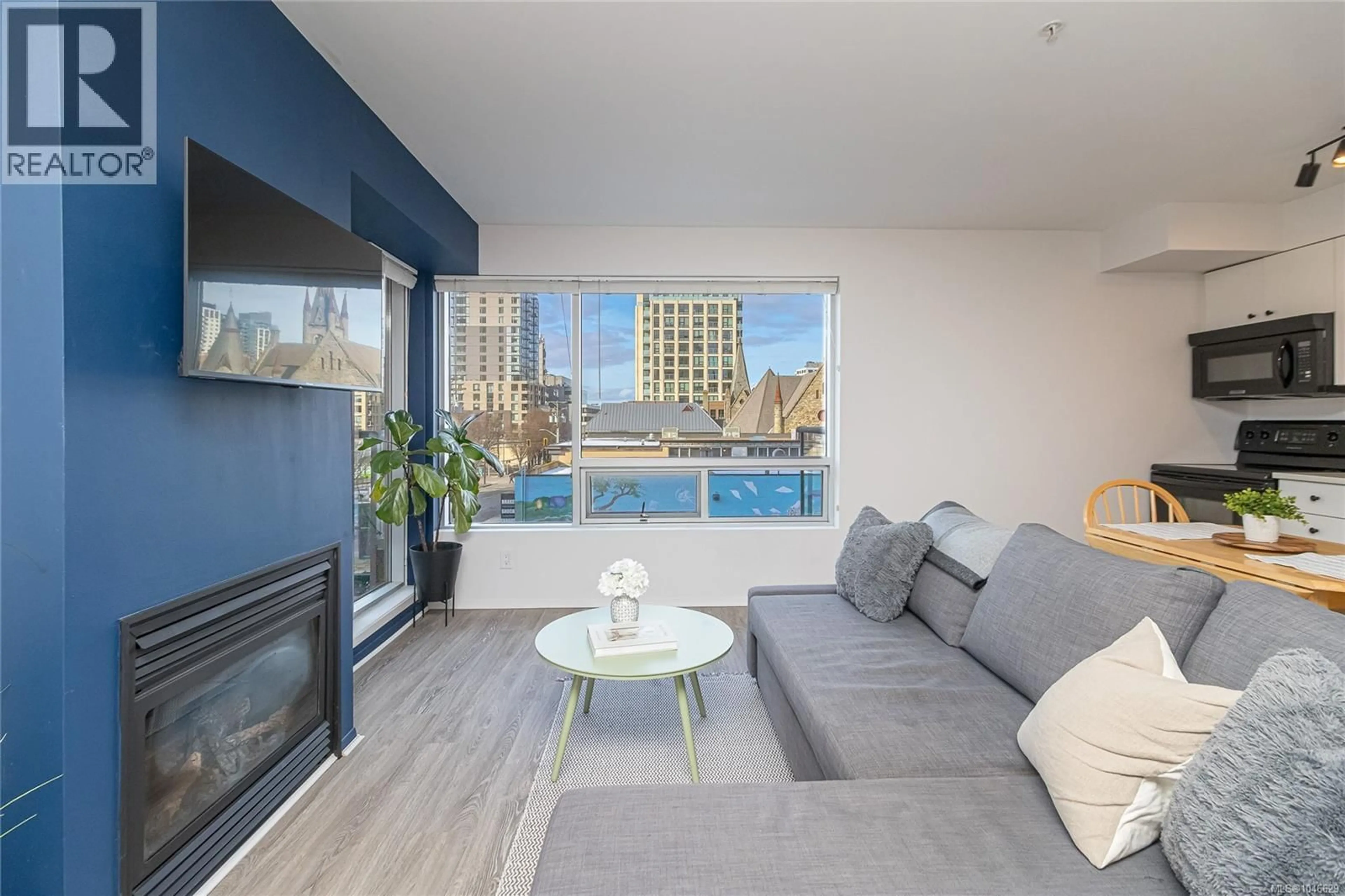 Living room with furniture, wood/laminate floor for 303 - 932 JOHNSON STREET, Victoria British Columbia V8V3N4