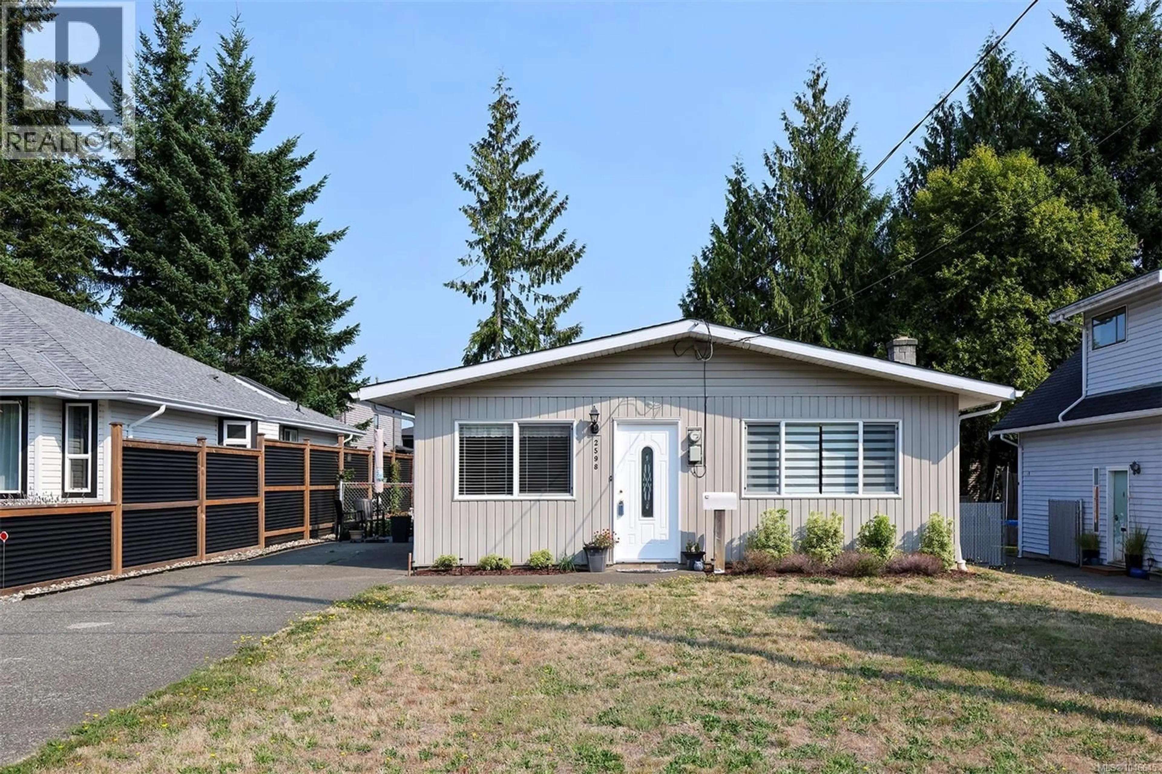 Home with vinyl exterior material, street for 2598 WILLARD AVENUE, Cumberland British Columbia V0R1S0