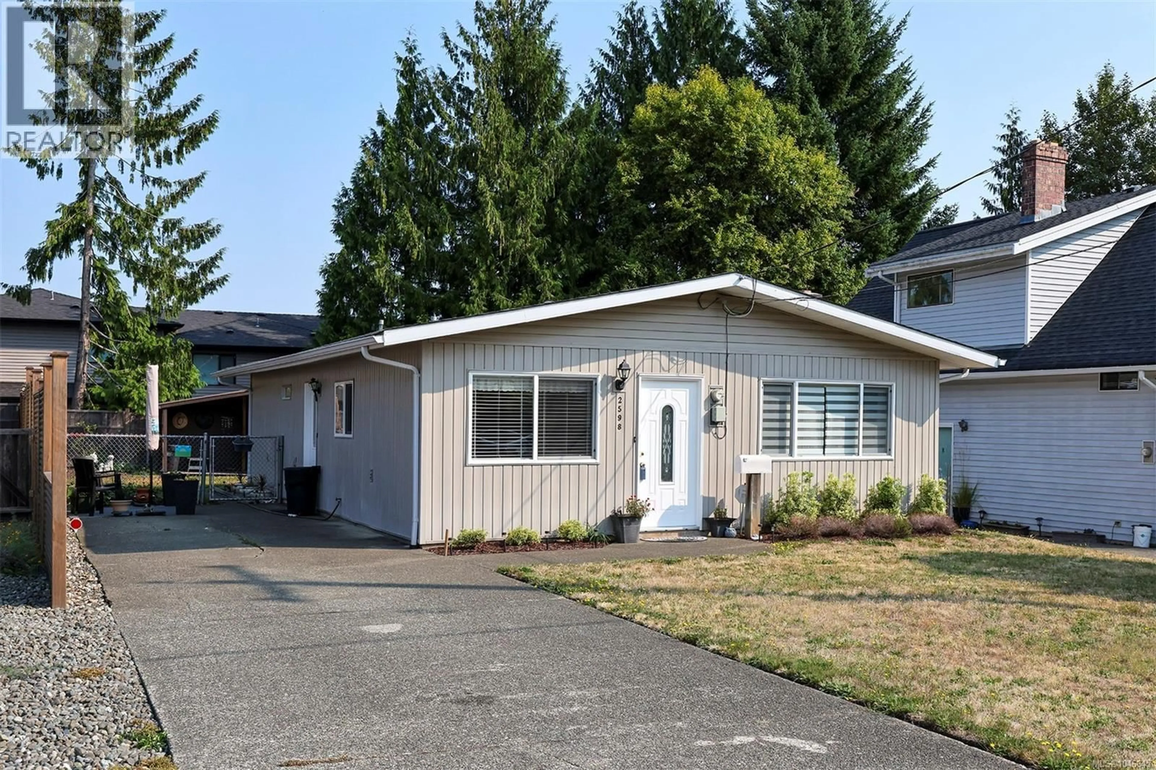 Home with vinyl exterior material, street for 2598 WILLARD AVENUE, Cumberland British Columbia V0R1S0