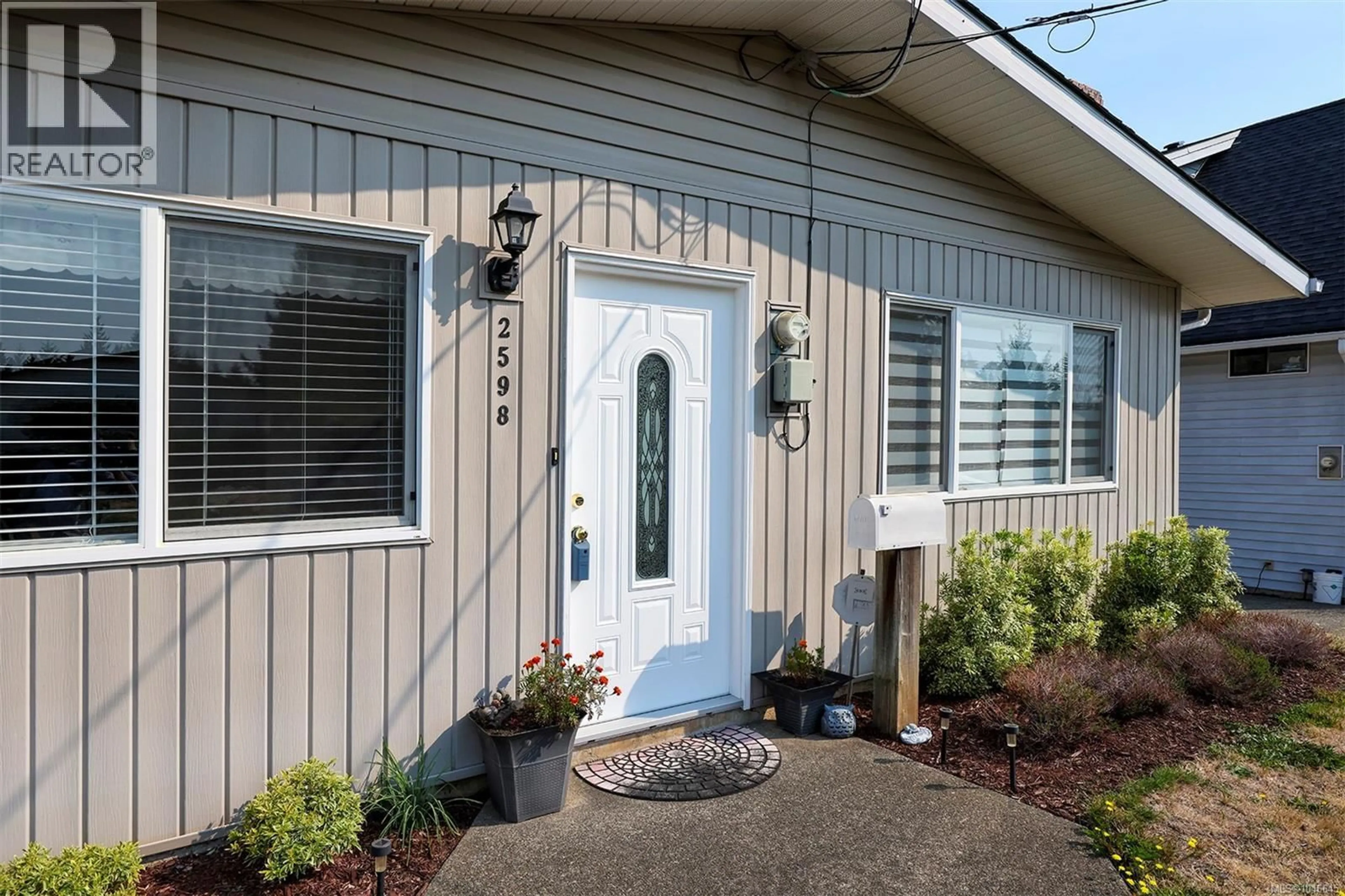 Home with vinyl exterior material, street for 2598 WILLARD AVENUE, Cumberland British Columbia V0R1S0