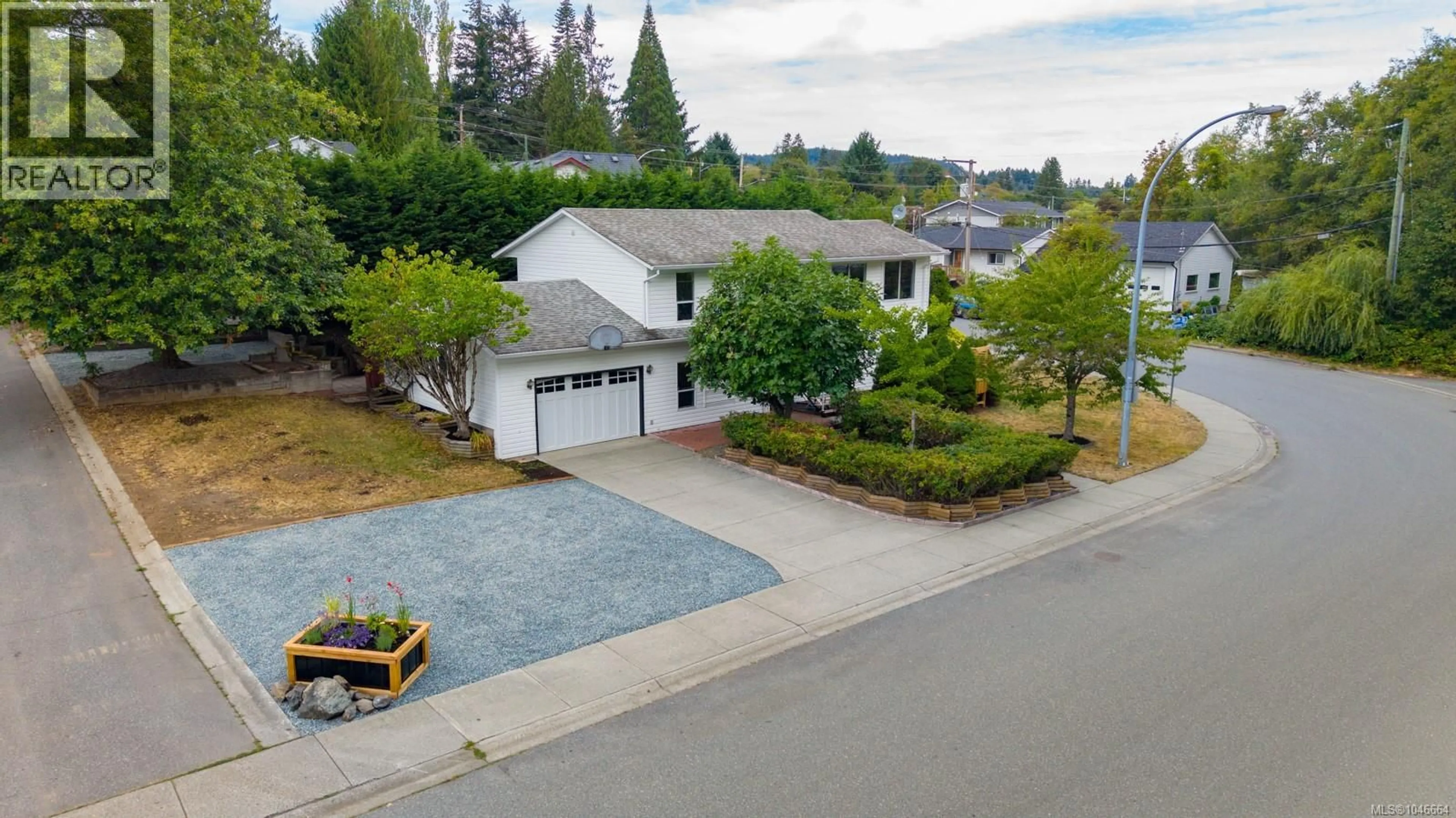 A pic from outside/outdoor area/front of a property/back of a property/a pic from drone, street for 1001 TIMBERWOOD DRIVE, Nanaimo British Columbia V9R6N9