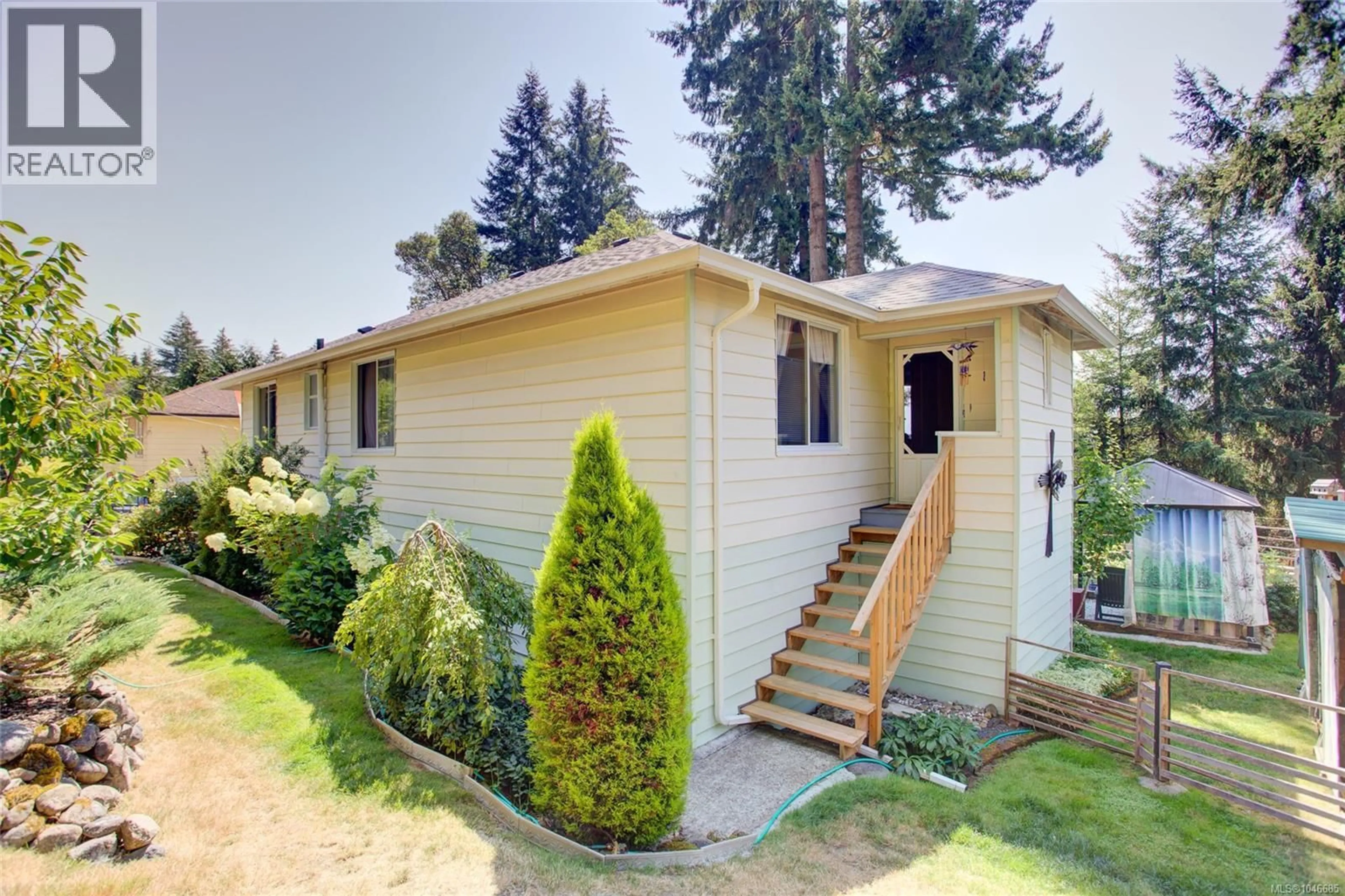 Home with vinyl exterior material, street for 10660 CEDAR DRIVE, Youbou British Columbia V0R3E1
