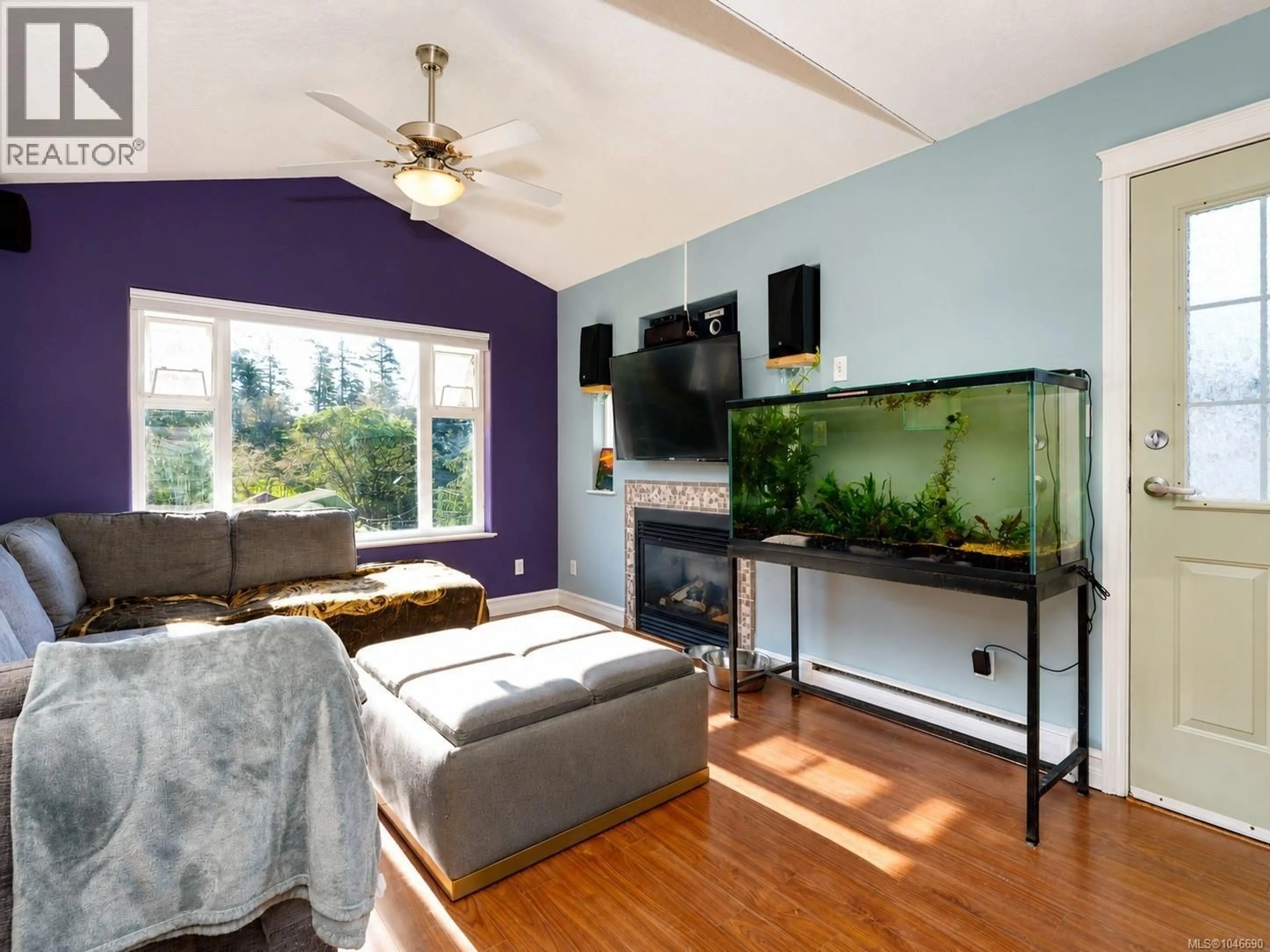 Living room with furniture, wood/laminate floor for 2562 WENTWICH ROAD, Langford British Columbia V9B3N4