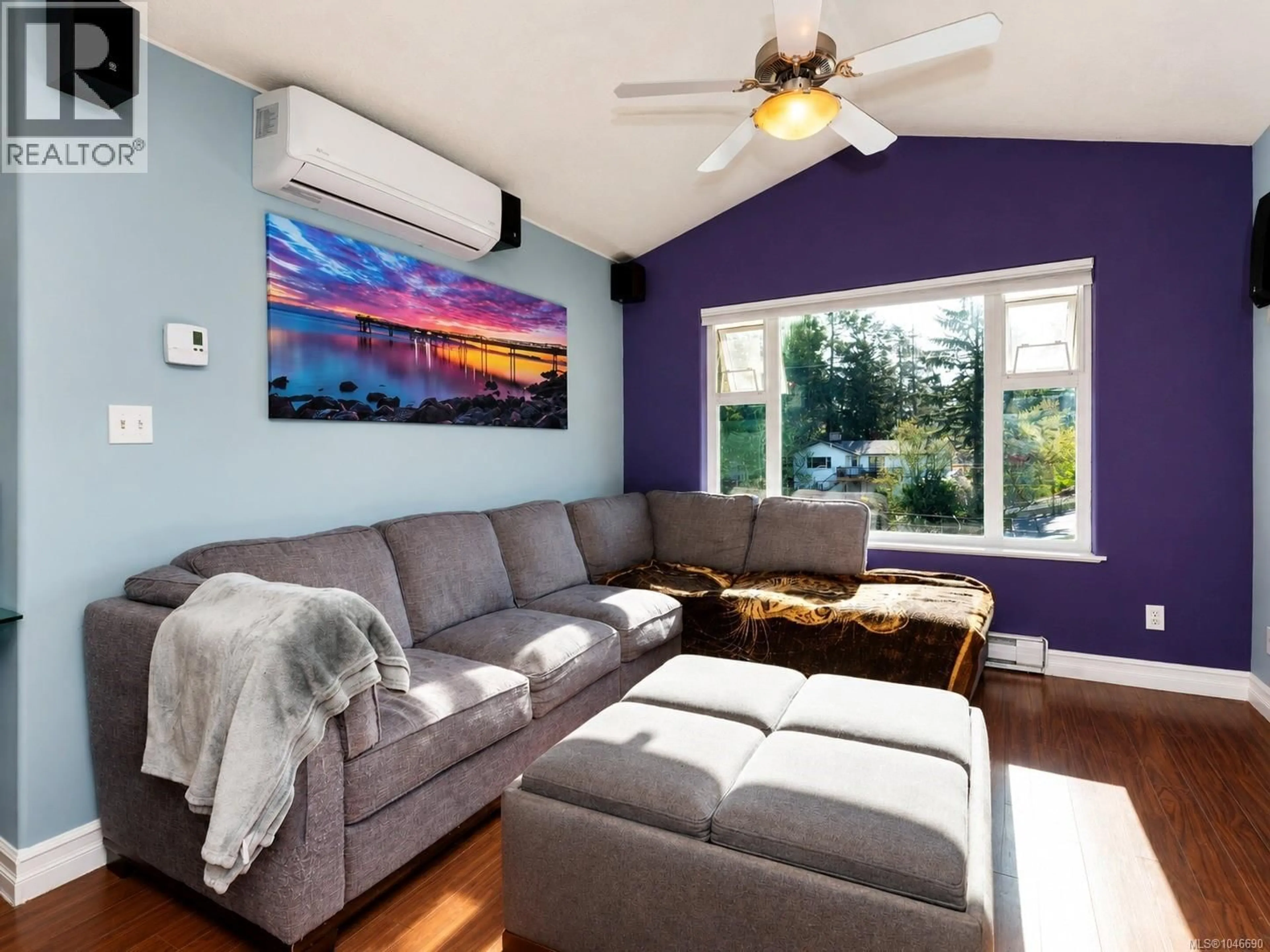 Living room with furniture, wood/laminate floor for 2562 WENTWICH ROAD, Langford British Columbia V9B3N4