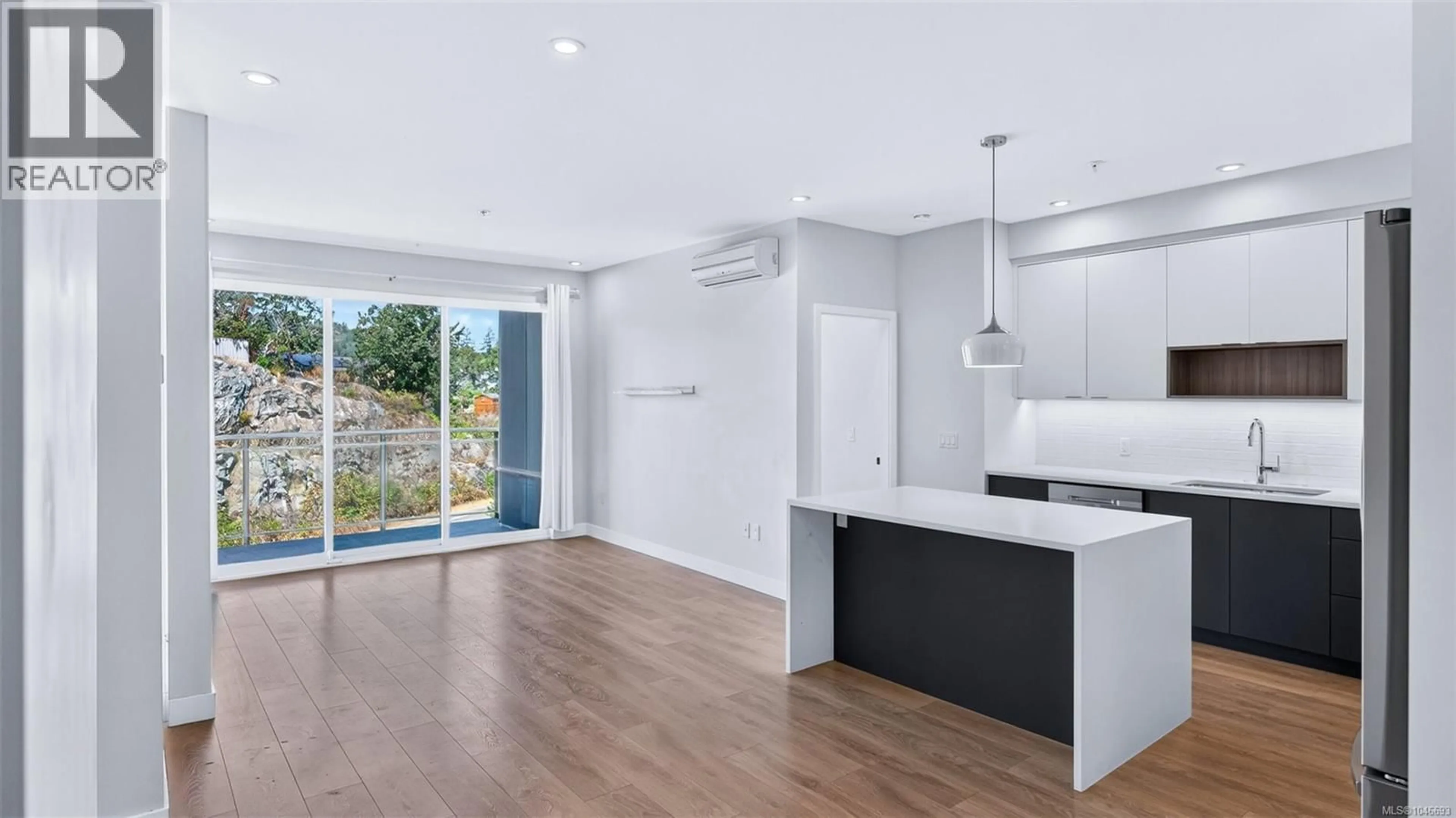Open concept kitchen, wood/laminate floor for 412 - 967 WHIRLAWAY CRESCENT, Langford British Columbia V9B0Y1
