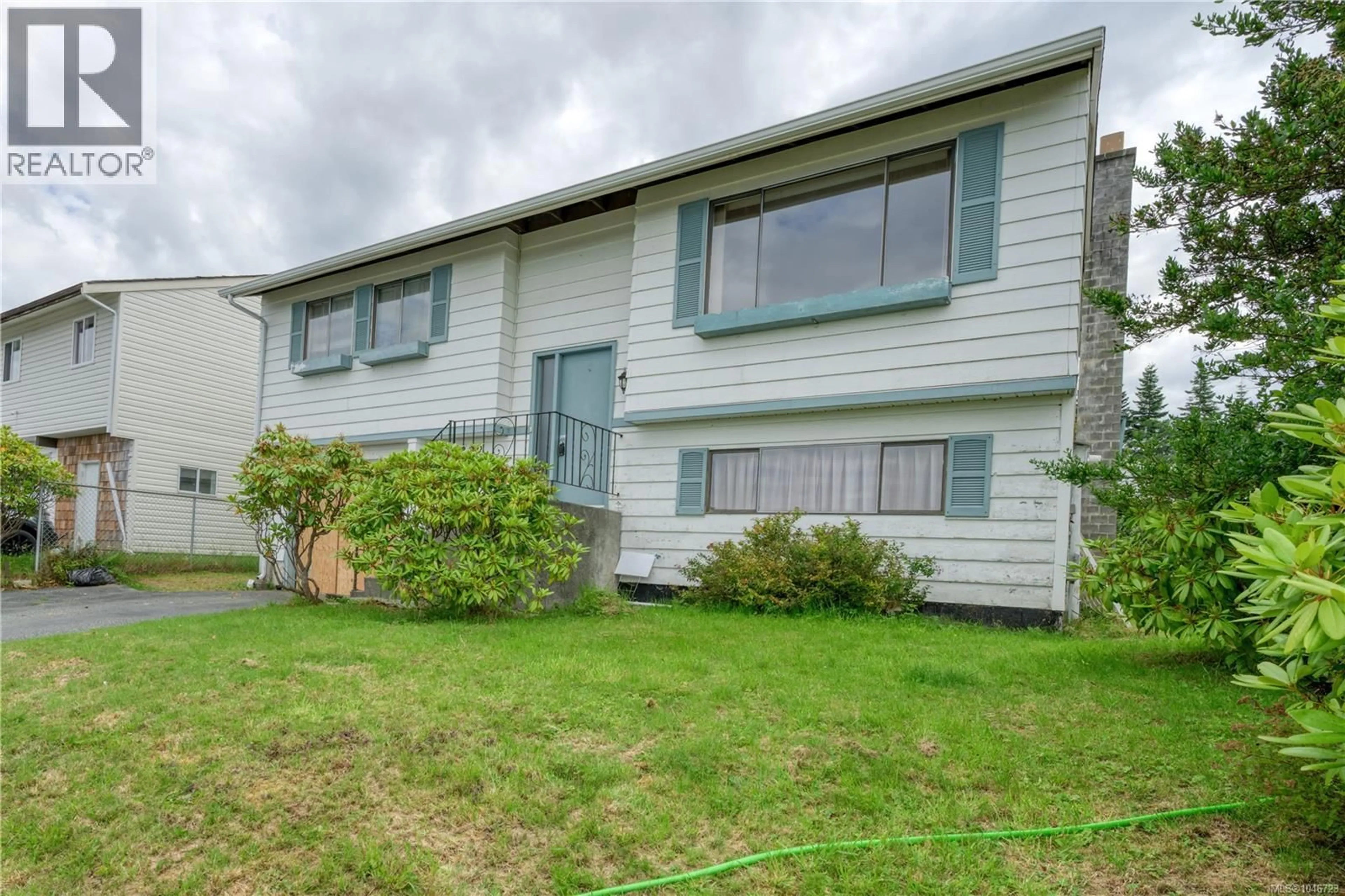 Home with vinyl exterior material, unknown for 2079 CAMOSUN CRESCENT, Port McNeill British Columbia V0N2R0