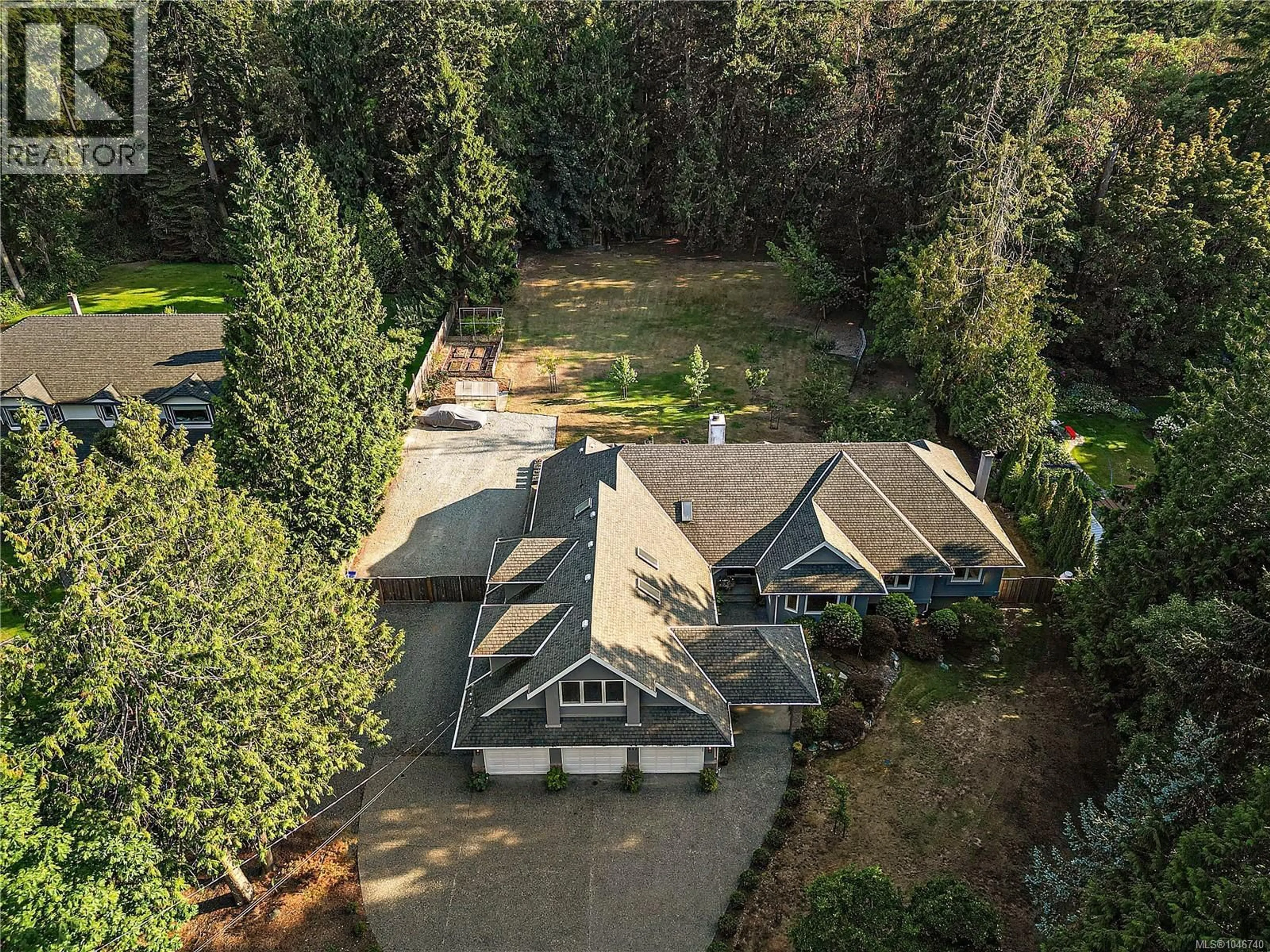 A pic from outside/outdoor area/front of a property/back of a property/a pic from drone, forest/trees view for 657 CROMARTY AVENUE, North Saanich British Columbia V8L5G6