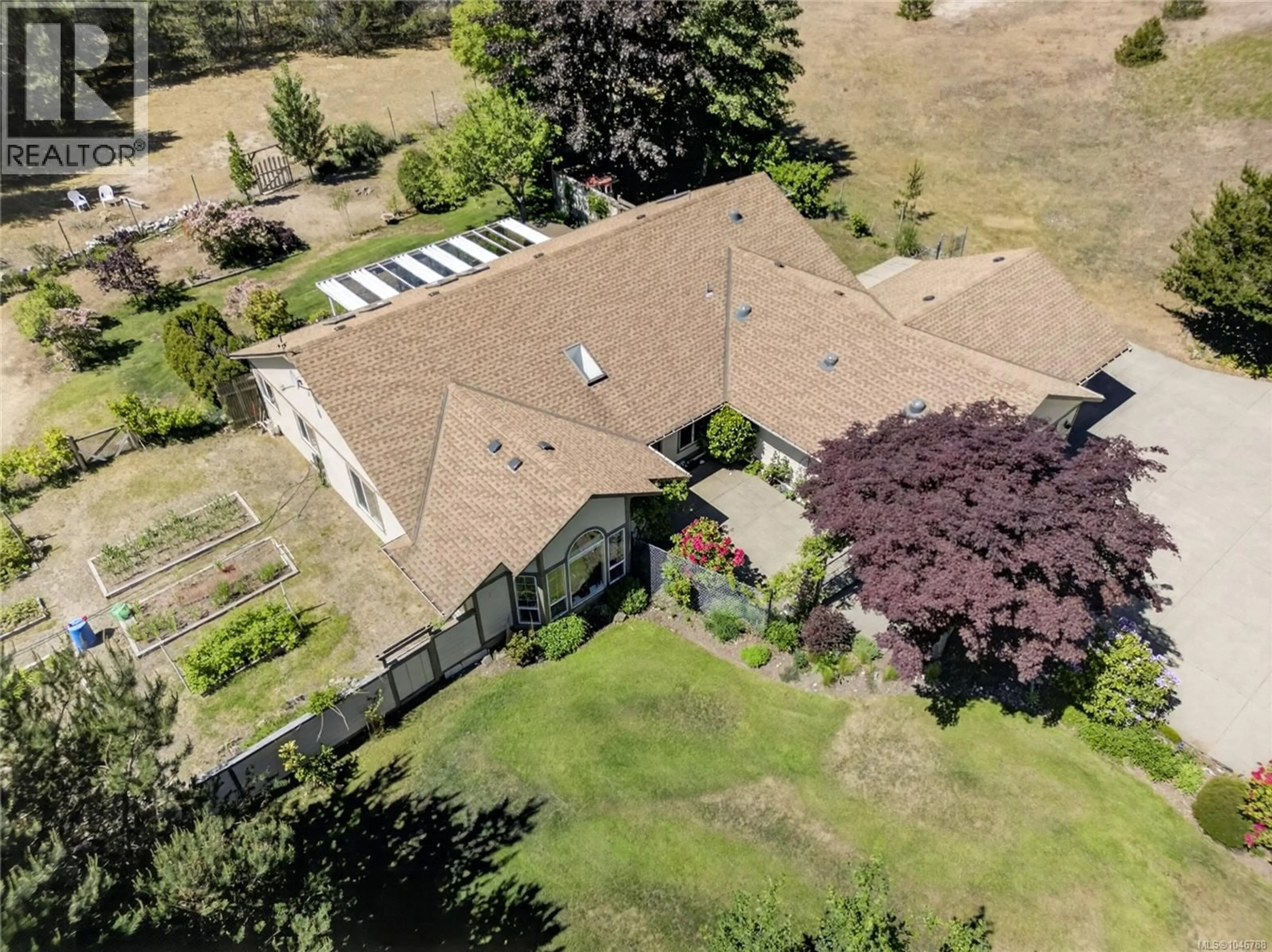 A pic from outside/outdoor area/front of a property/back of a property/a pic from drone, building for 657 SIERRA PINES ROAD, Comox British Columbia V9M3W8