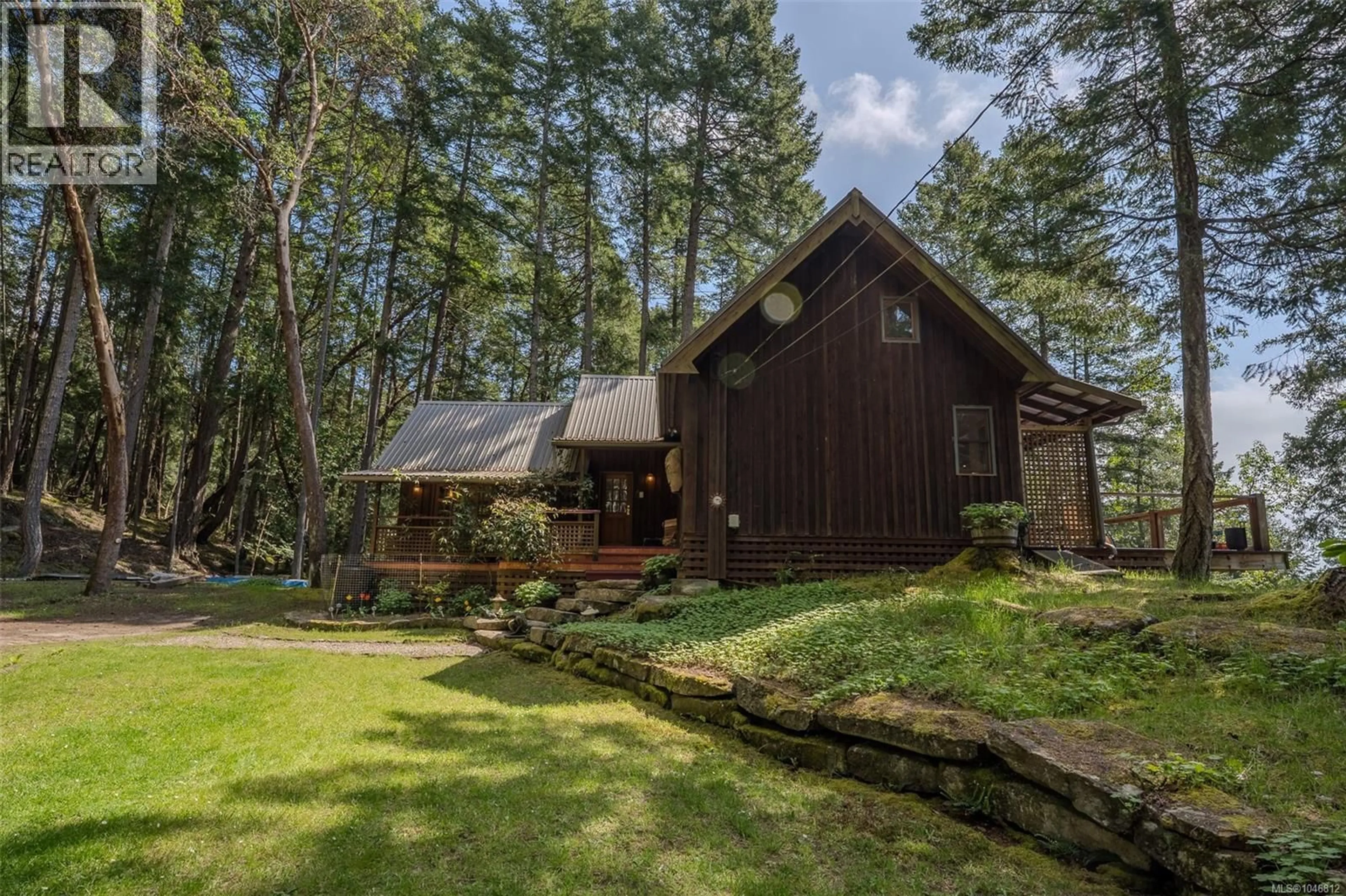 A pic from outside/outdoor area/front of a property/back of a property/a pic from drone, forest/trees view for 231 HALIBUT HILL ROAD, Mudge Island British Columbia V0R1X6