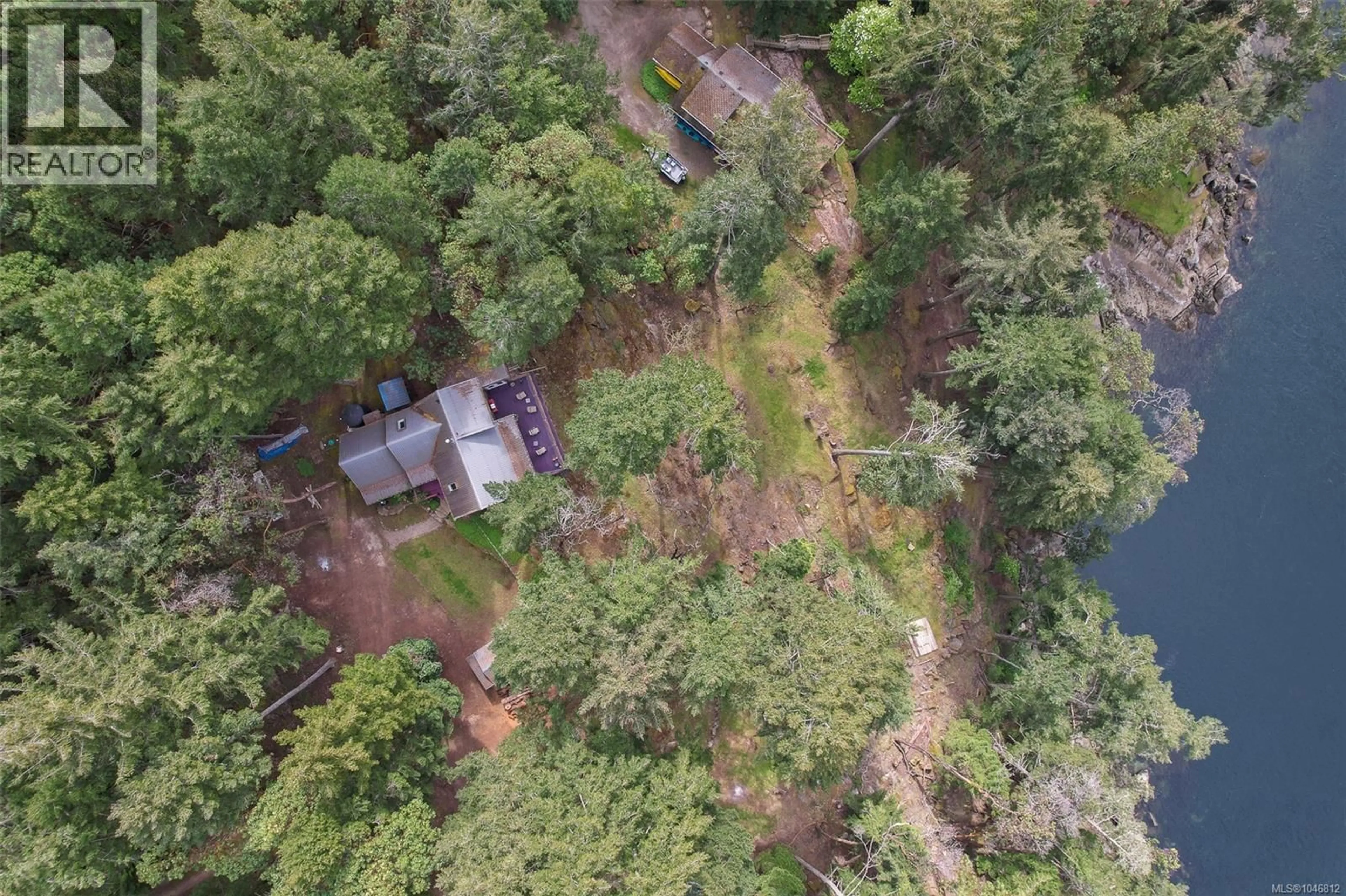 A pic from outside/outdoor area/front of a property/back of a property/a pic from drone, forest/trees view for 231 HALIBUT HILL ROAD, Mudge Island British Columbia V0R1X6