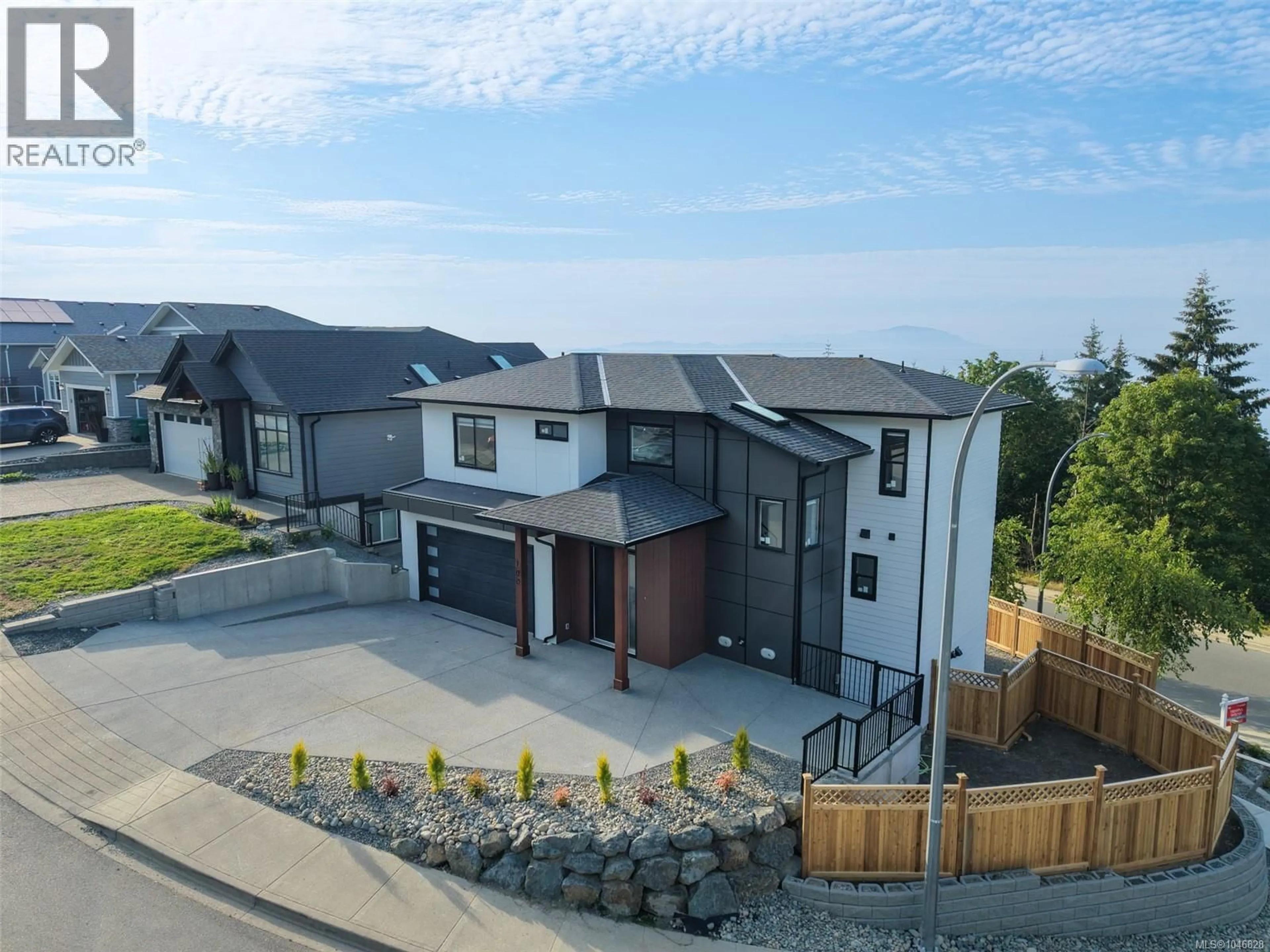A pic from outside/outdoor area/front of a property/back of a property/a pic from drone, mountain view for 100 ROYAL PACIFIC WAY, Nanaimo British Columbia V9T5L7