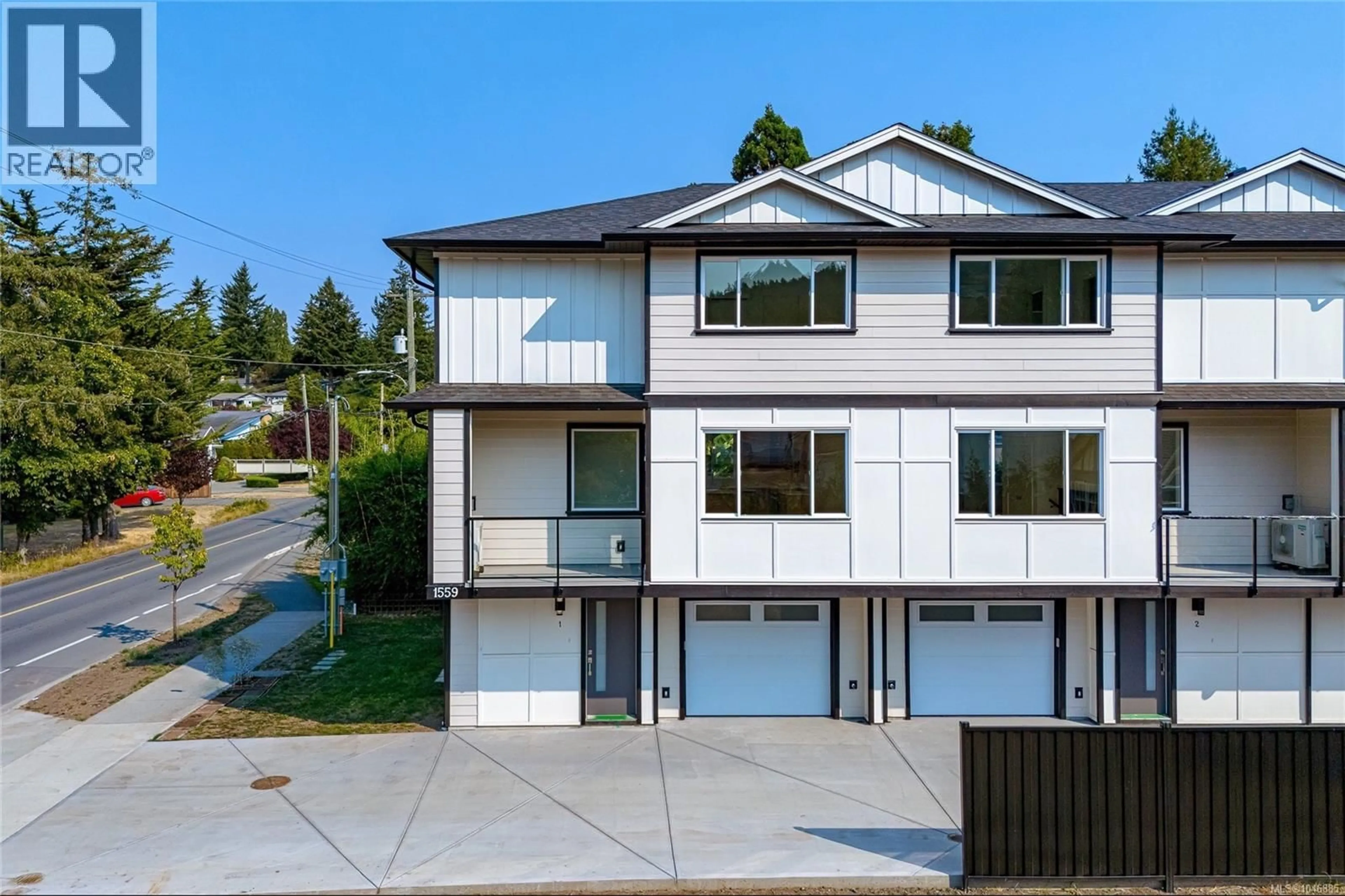 A pic from outside/outdoor area/front of a property/back of a property/a pic from drone, street for 1 - 1559 ASH ROAD, Saanich British Columbia V8N2S9