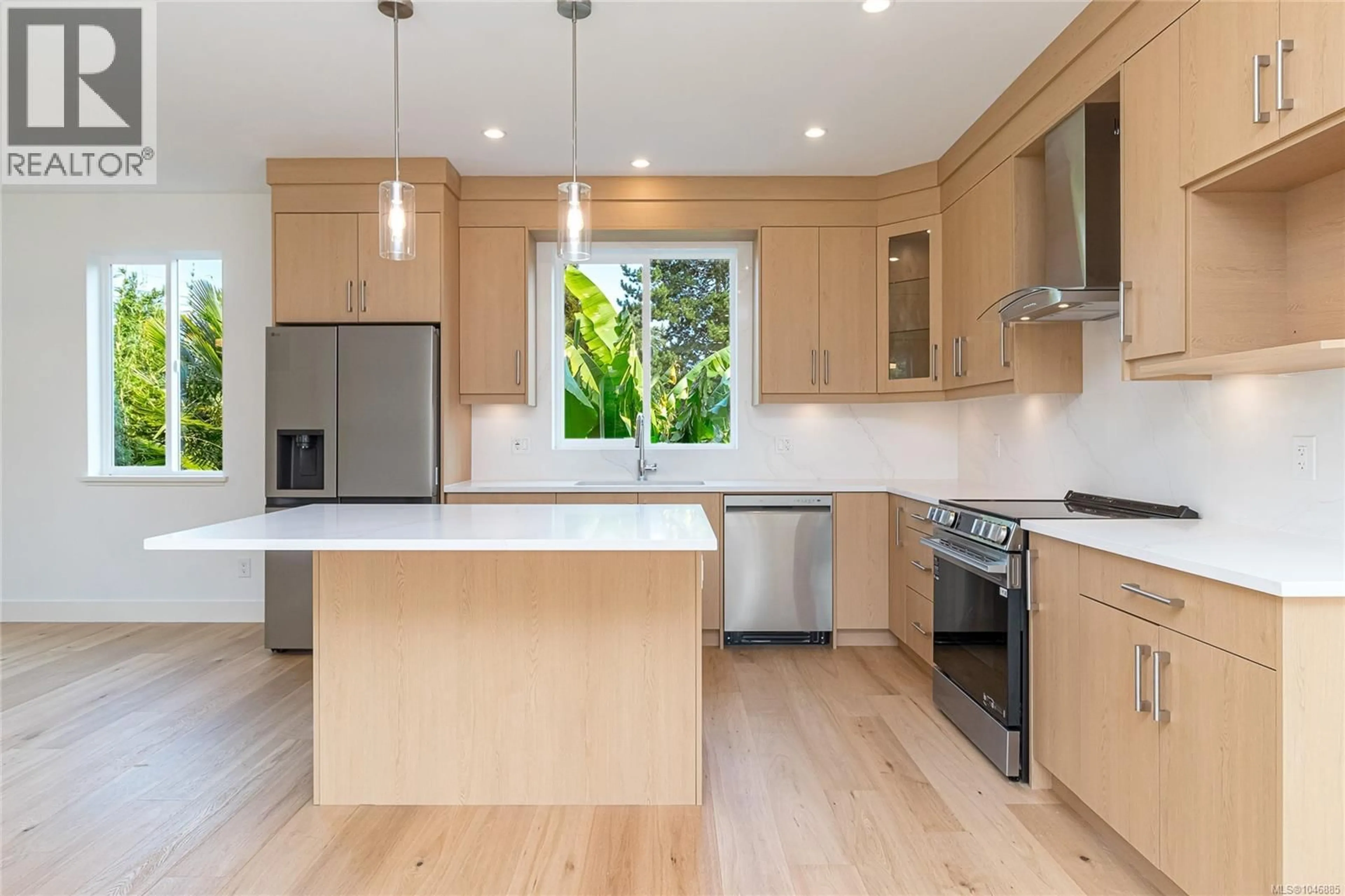 Open concept kitchen, wood/laminate floor for 1 - 1559 ASH ROAD, Saanich British Columbia V8N2S9