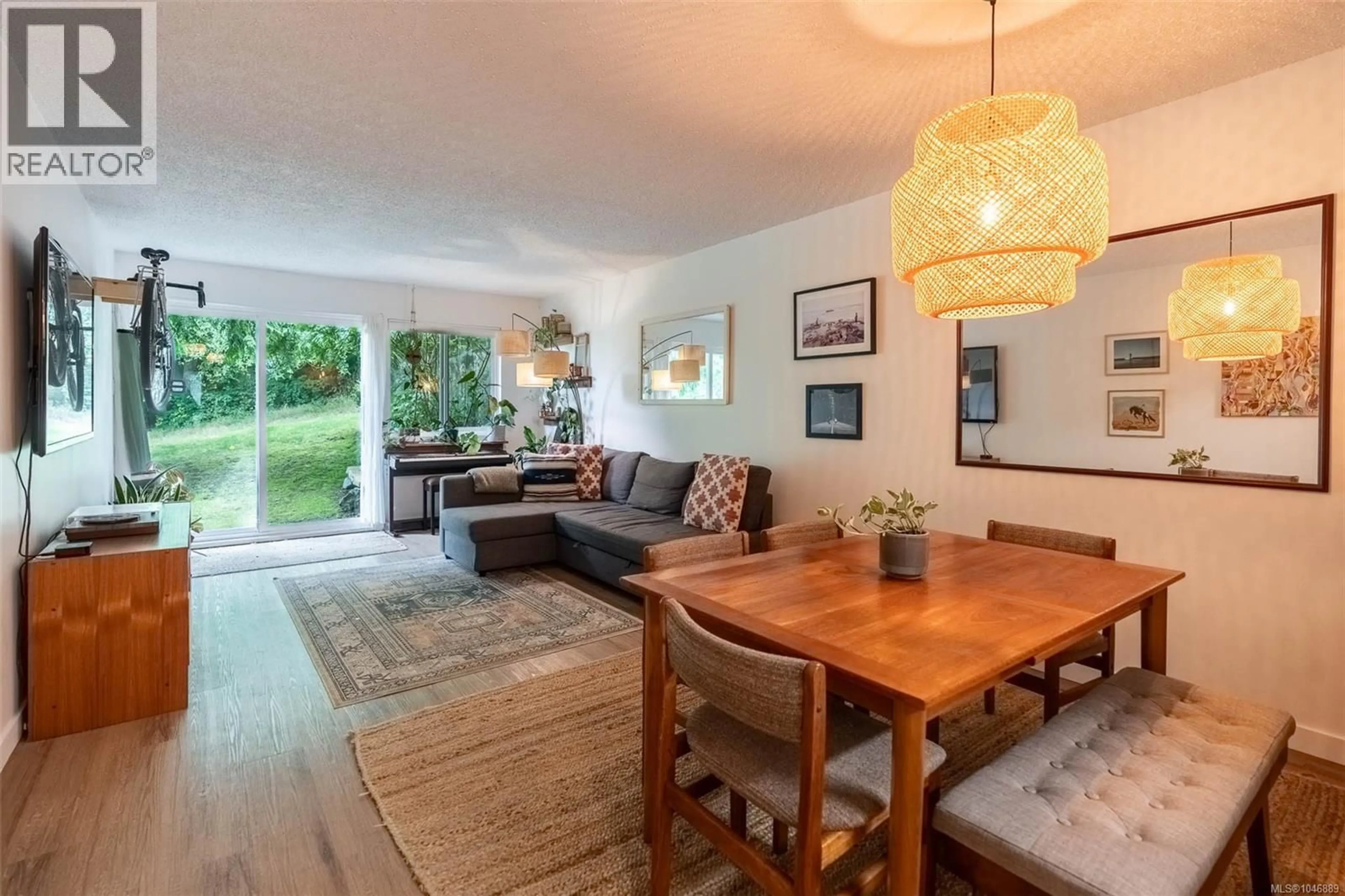 Living room with furniture, wood/laminate floor for 209 - 250 HEMLOCK STREET, Ucluelet British Columbia V0R3A0