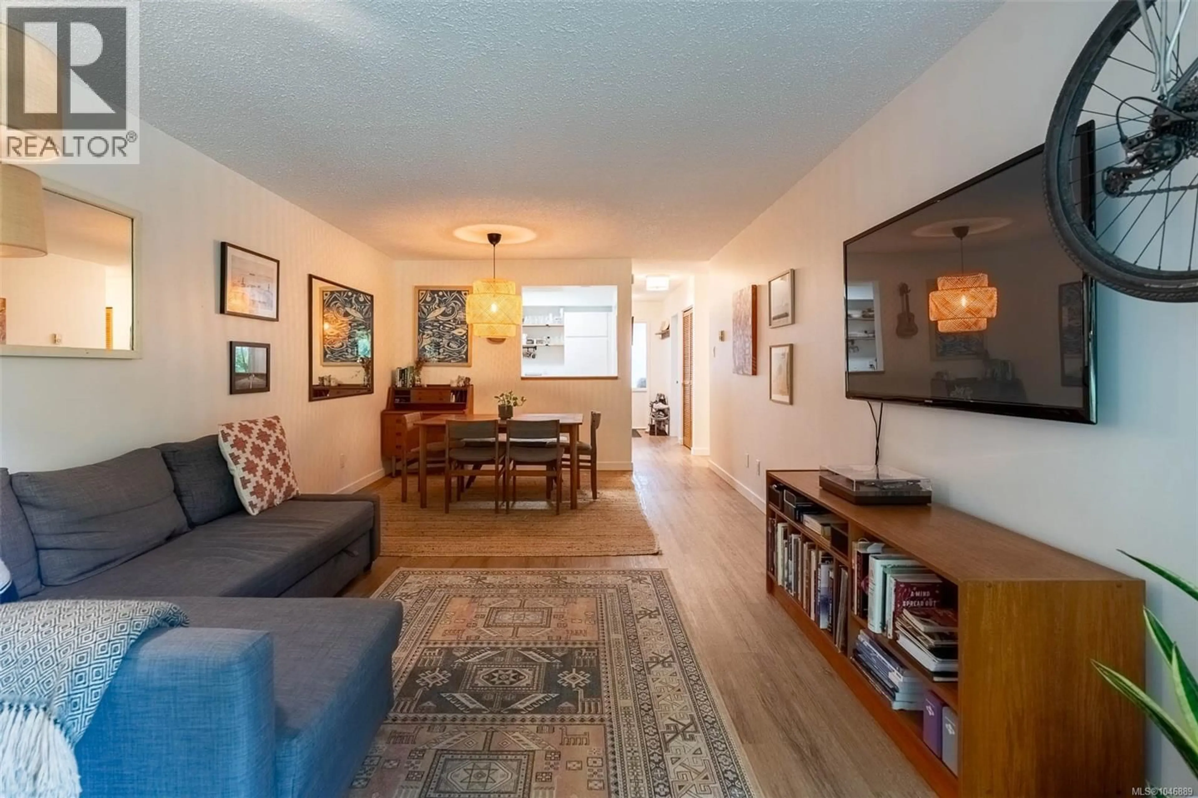 Living room with furniture, wood/laminate floor for 209 - 250 HEMLOCK STREET, Ucluelet British Columbia V0R3A0