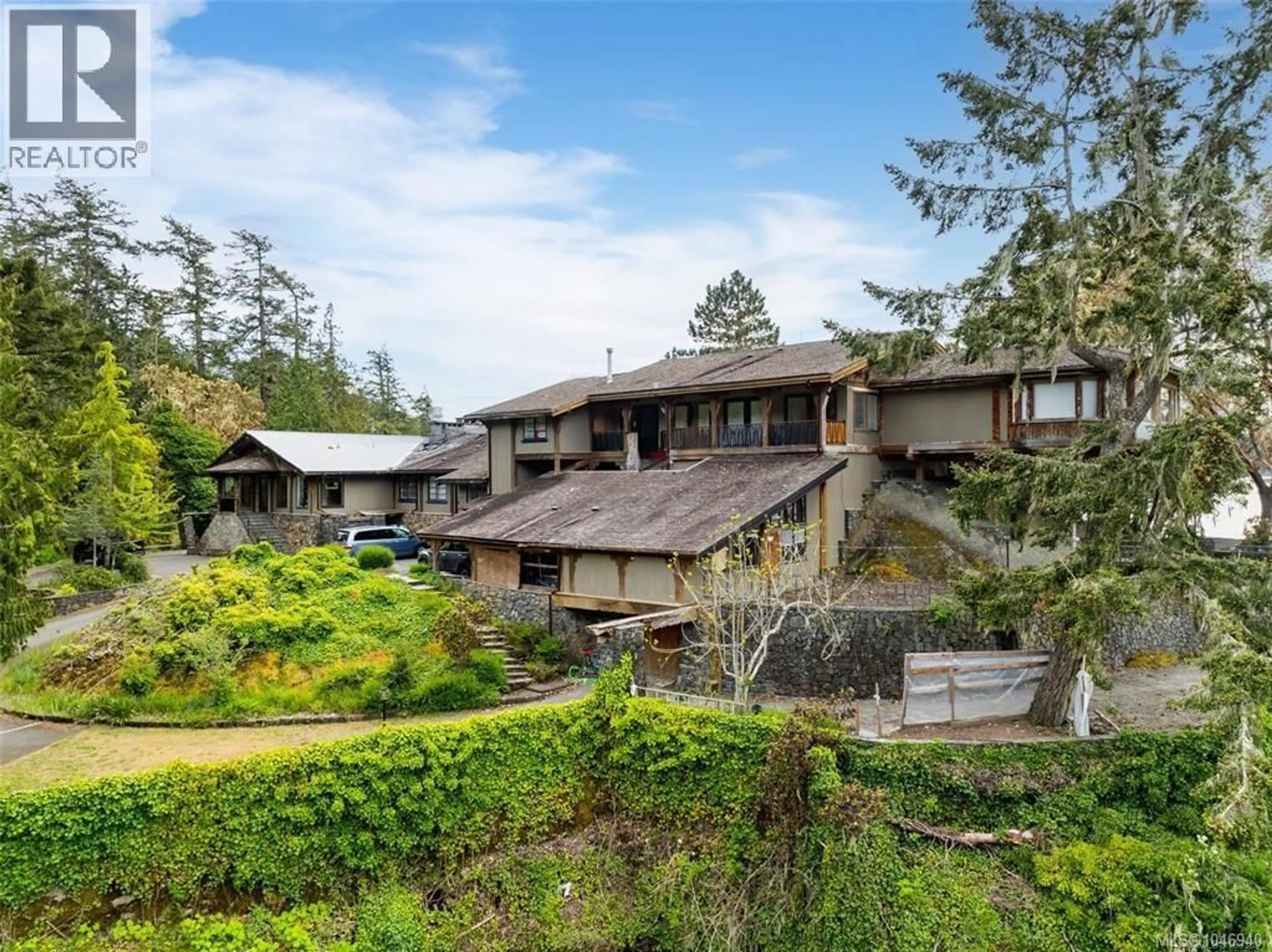 A pic from outside/outdoor area/front of a property/back of a property/a pic from drone, mountain view for 1424 GILLESPIE ROAD, Sooke British Columbia V9Z0Z2