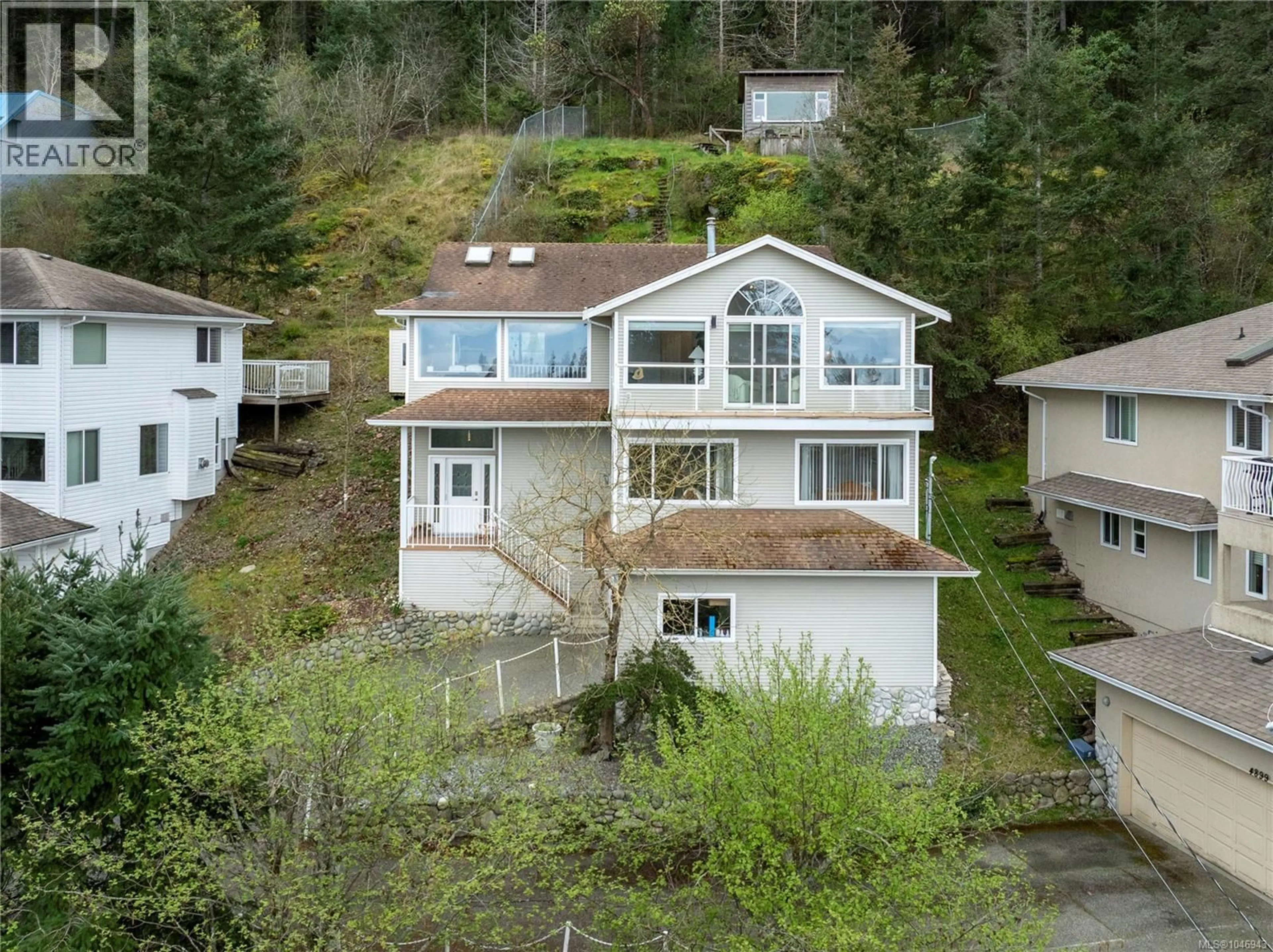 A pic from outside/outdoor area/front of a property/back of a property/a pic from drone, water/lake/river/ocean view for 4895 LAGUNA WAY, Nanaimo British Columbia V9T5C2