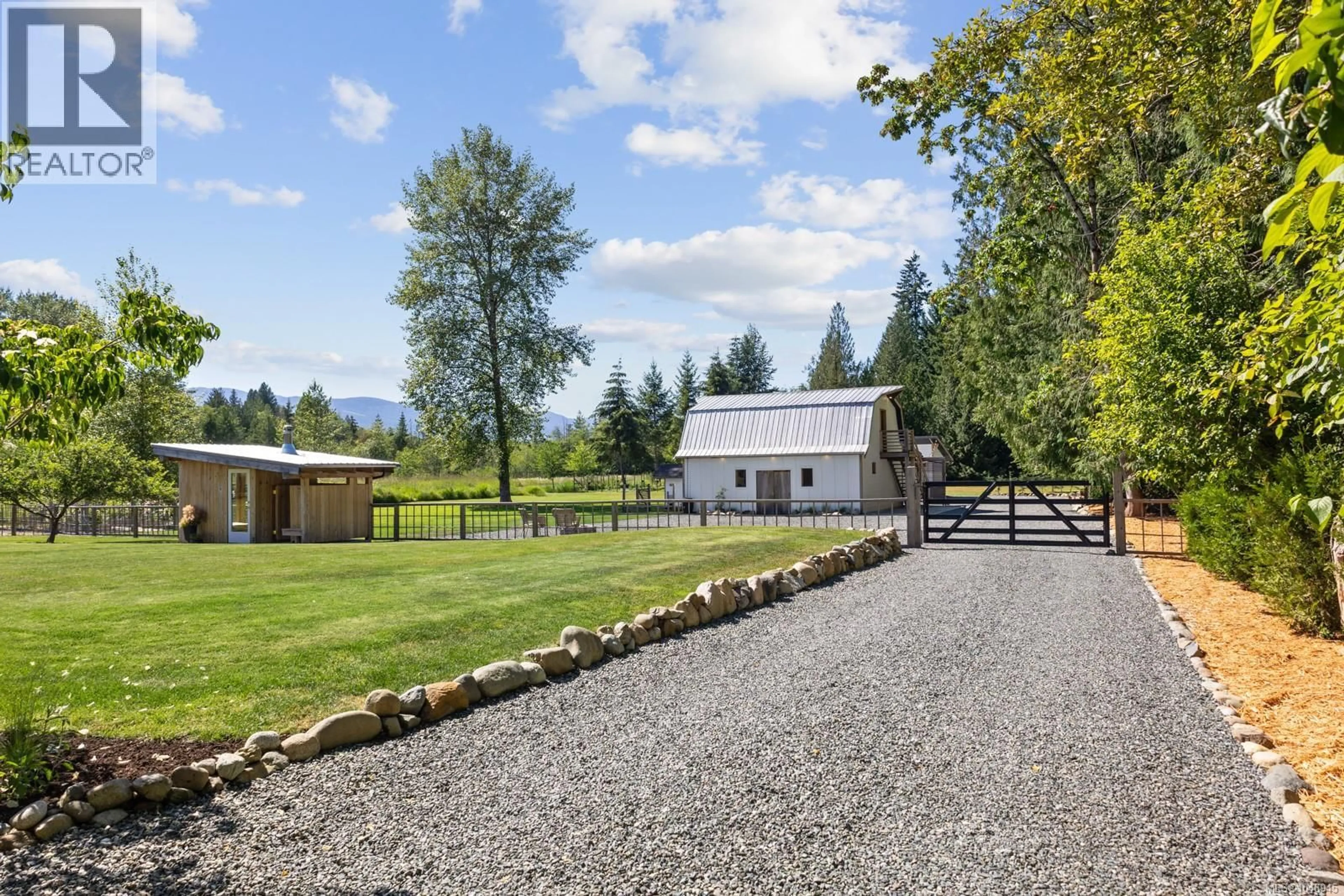 A pic from outside/outdoor area/front of a property/back of a property/a pic from drone, mountain view for 2925 BAIRD ROAD, Courtenay British Columbia V9N9N6