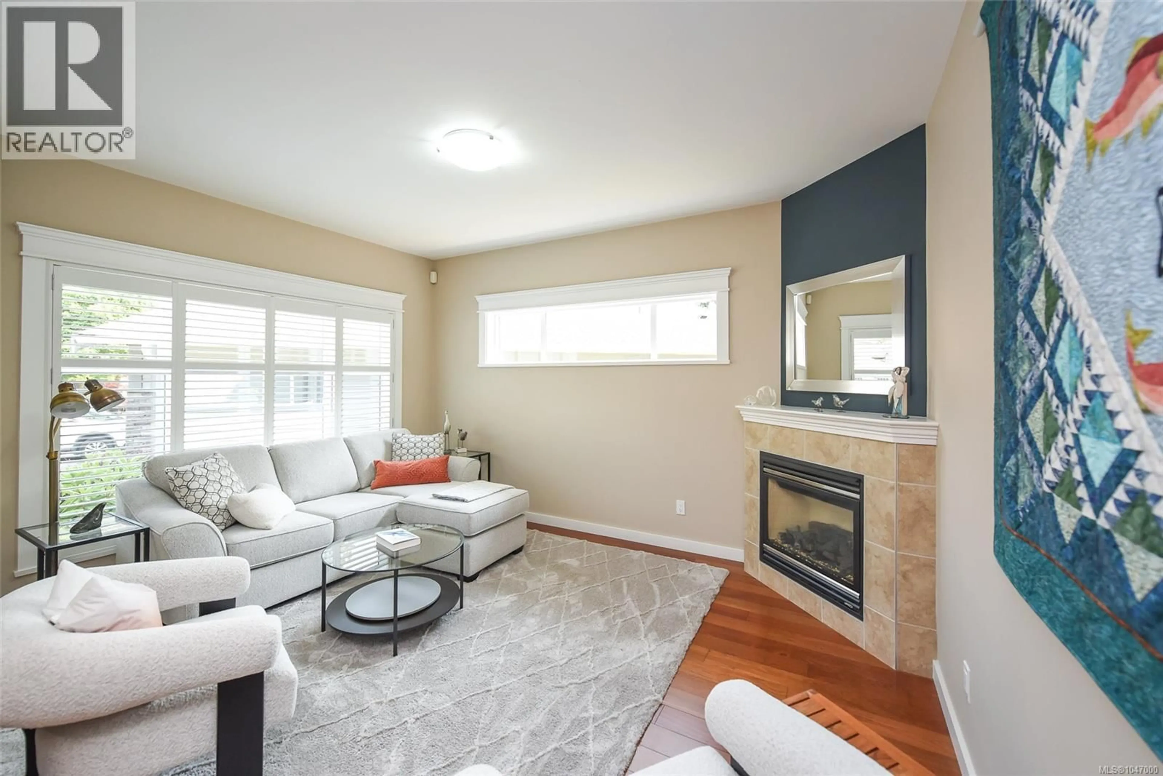 Living room with furniture, wood/laminate floor for 61 - 2001 BLUE JAY PLACE, Courtenay British Columbia V9N4A8