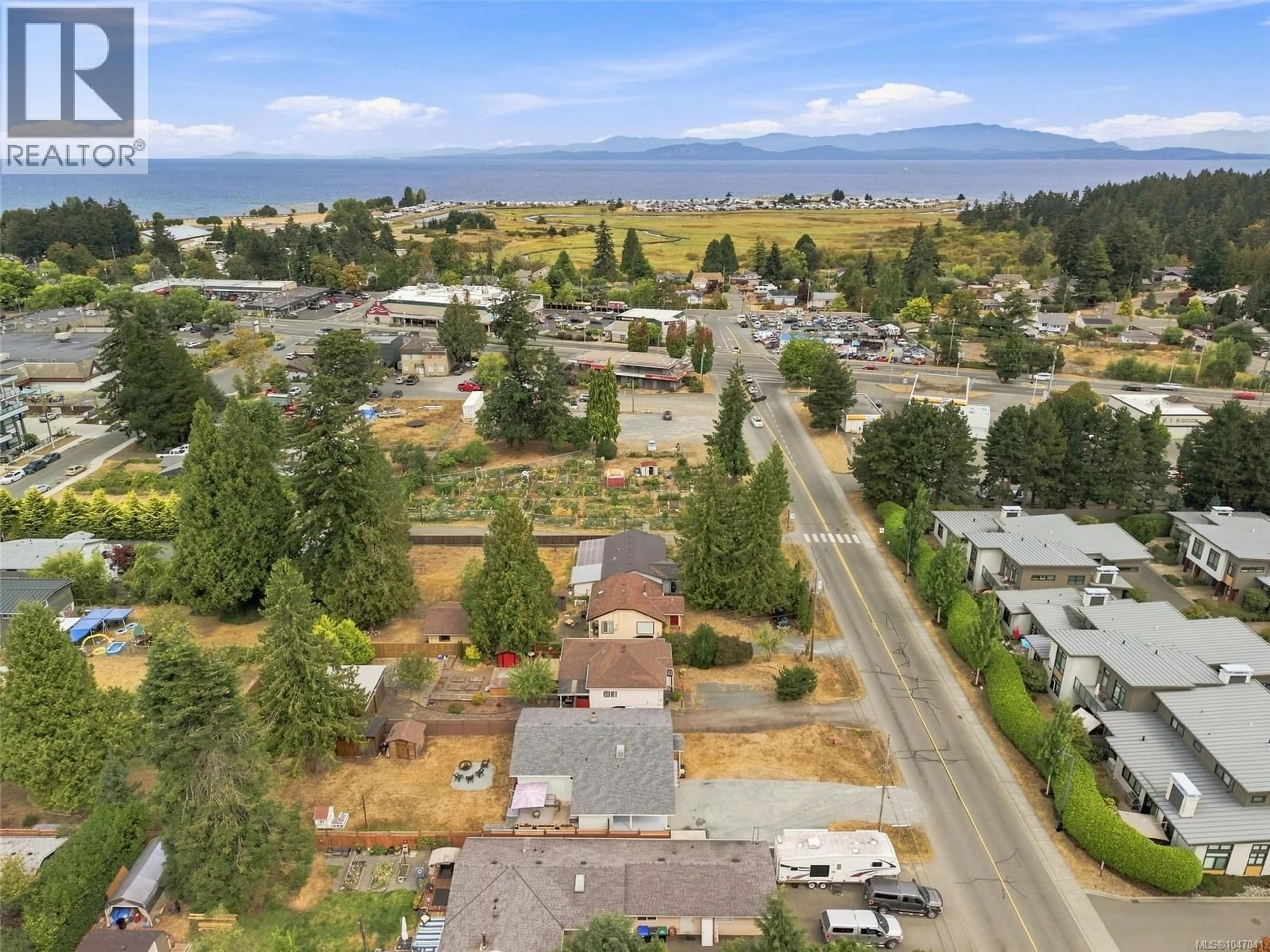 A pic from outside/outdoor area/front of a property/back of a property/a pic from drone, mountain view for 219 MCVICKERS STREET, Parksville British Columbia V9P0B9