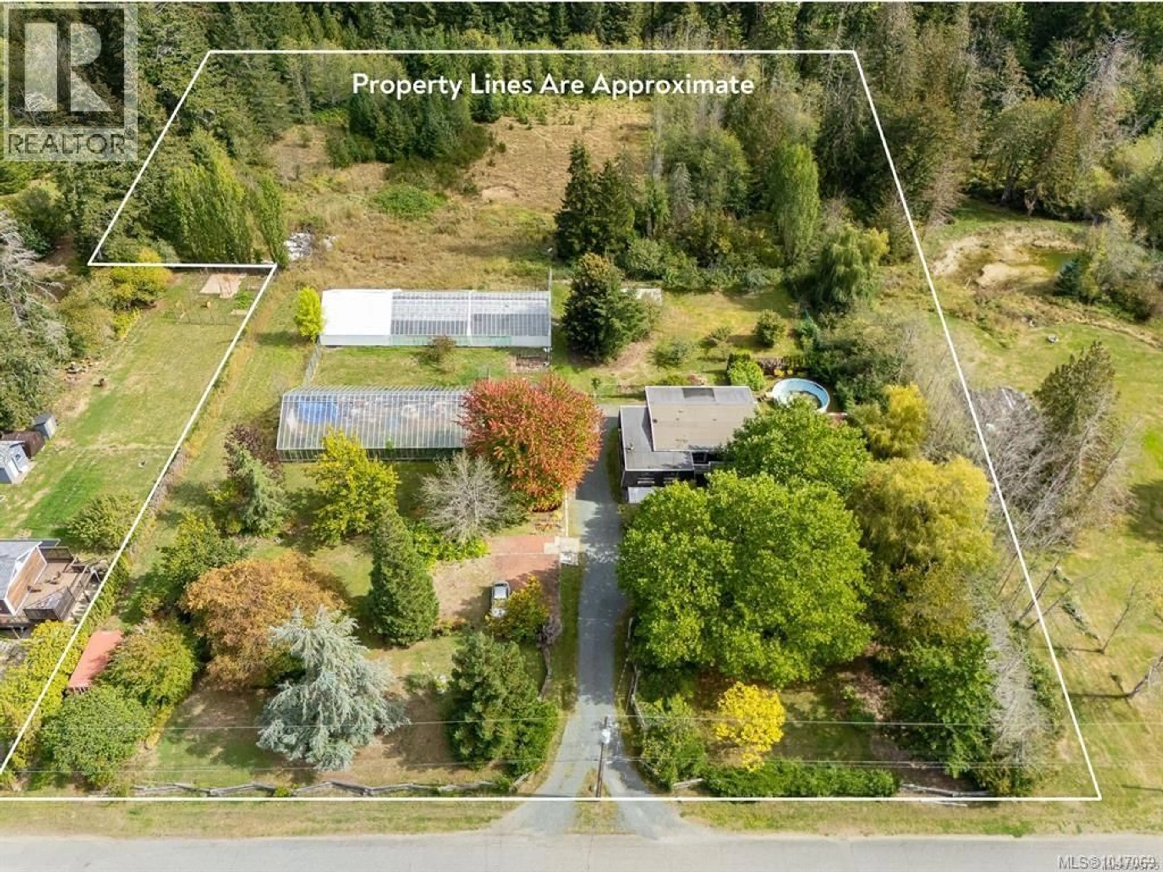 A pic from outside/outdoor area/front of a property/back of a property/a pic from drone, forest/trees view for 5633 STRICK ROAD, Port Alberni British Columbia V9Y7L5
