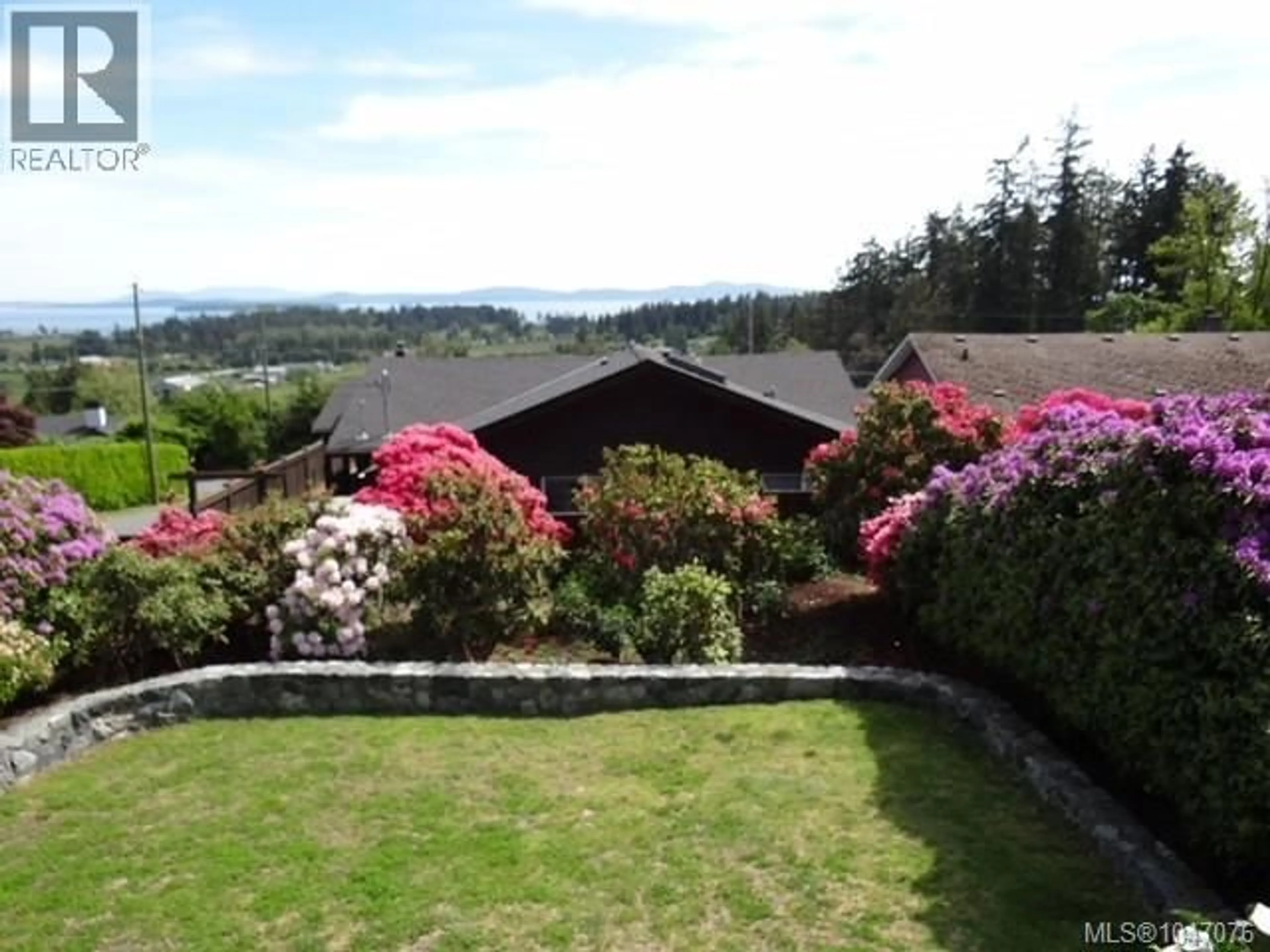 A pic from outside/outdoor area/front of a property/back of a property/a pic from drone, water/lake/river/ocean view for 711 WELLS ROAD, Saanich British Columbia V8Y1R6