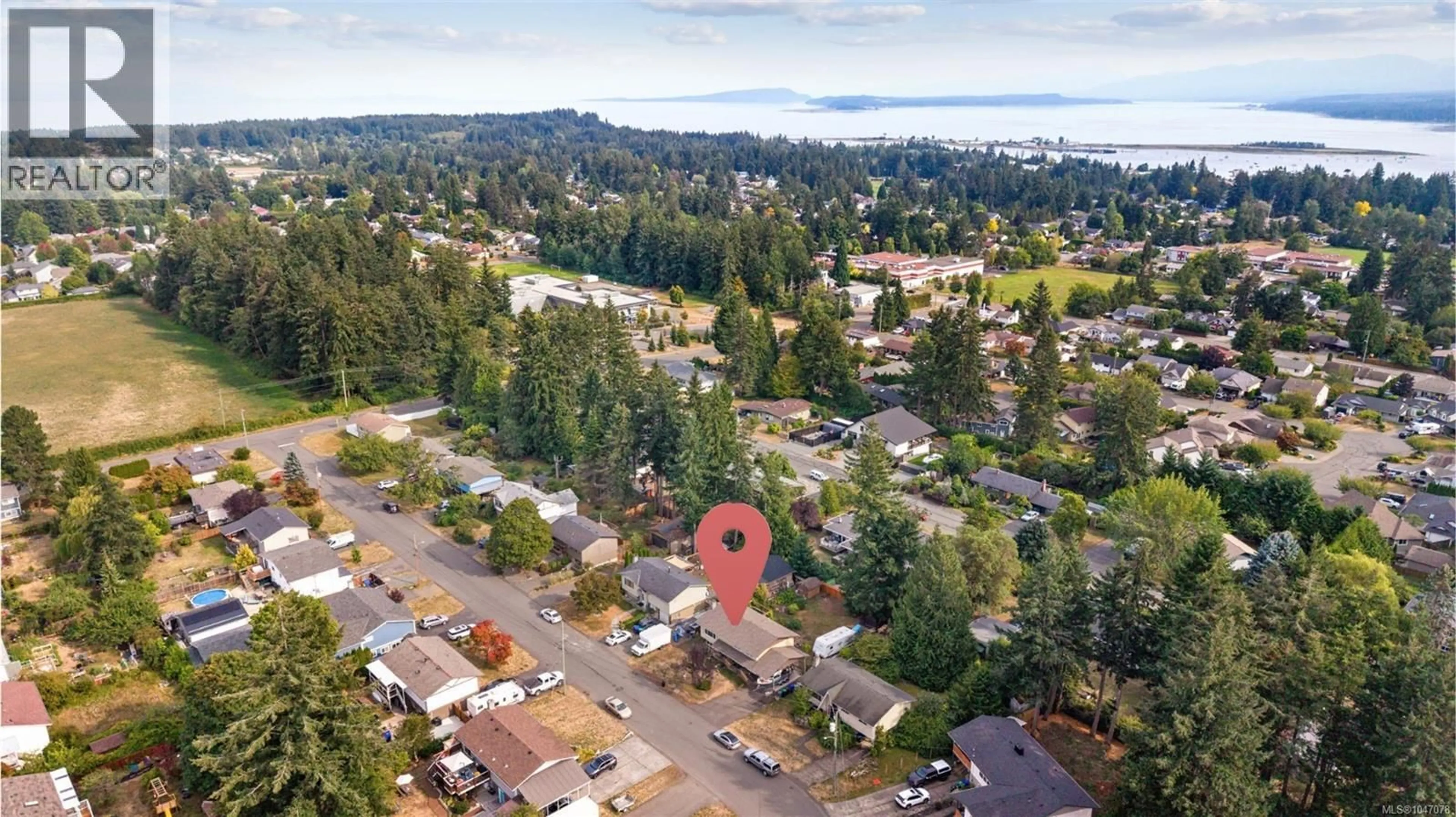 A pic from outside/outdoor area/front of a property/back of a property/a pic from drone, unknown for 1925 COUGAR CRESCENT, Comox British Columbia V9M2K4