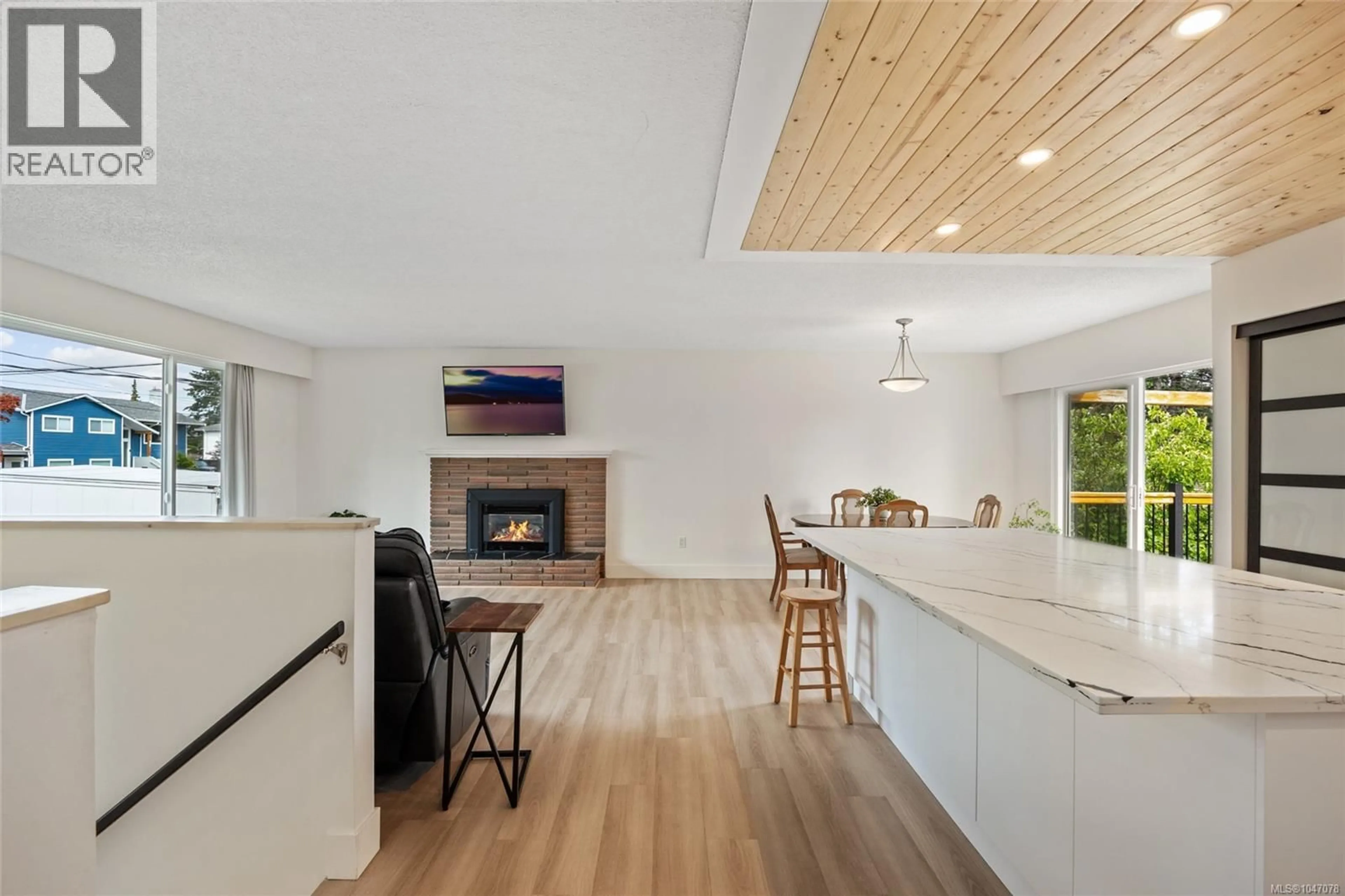 Open concept kitchen, wood/laminate floor for 1925 COUGAR CRESCENT, Comox British Columbia V9M2K4
