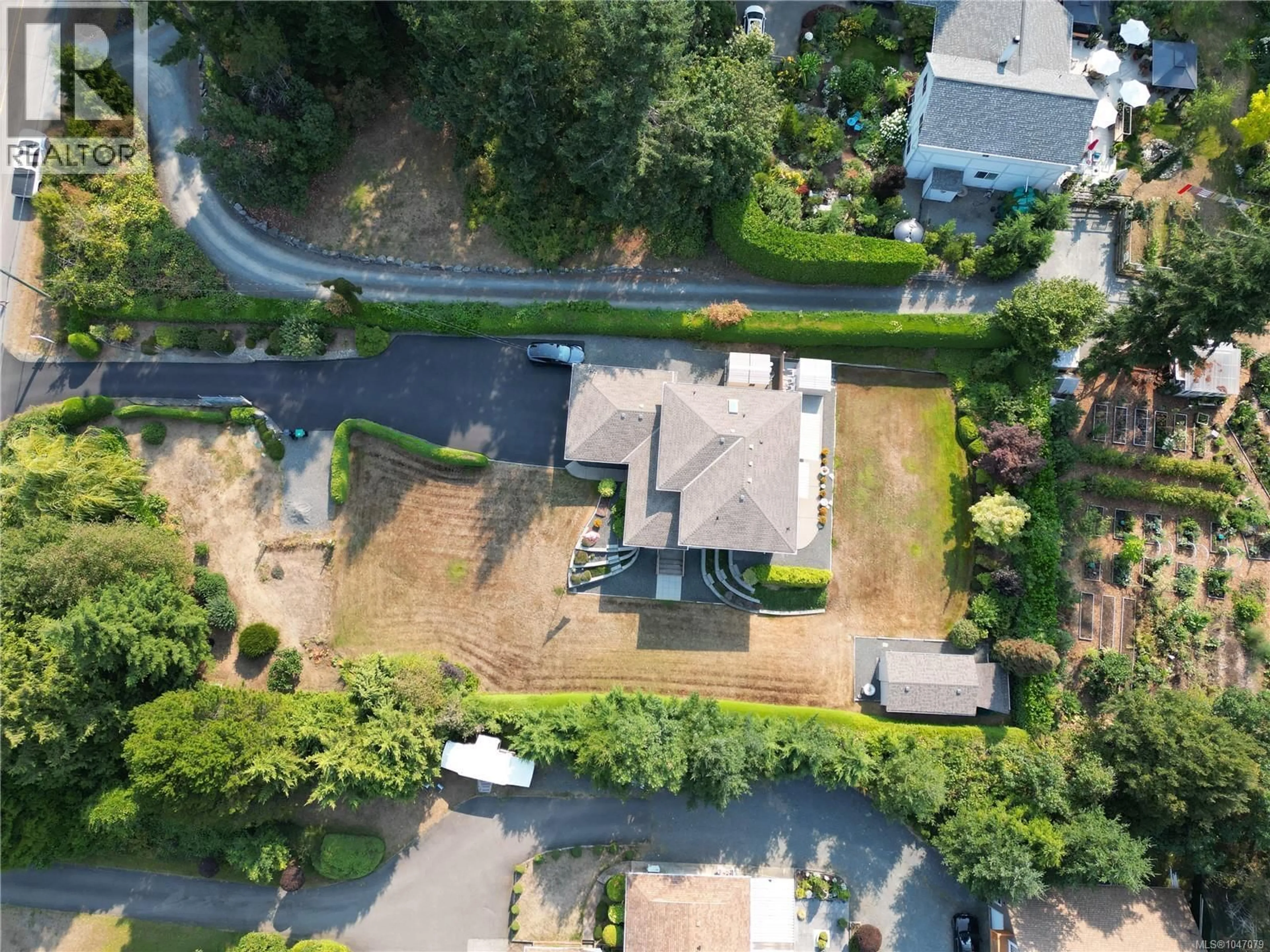 A pic from outside/outdoor area/front of a property/back of a property/a pic from drone, street for 2552 SEA BLUSH DRIVE, Nanoose Bay British Columbia V9P9E4