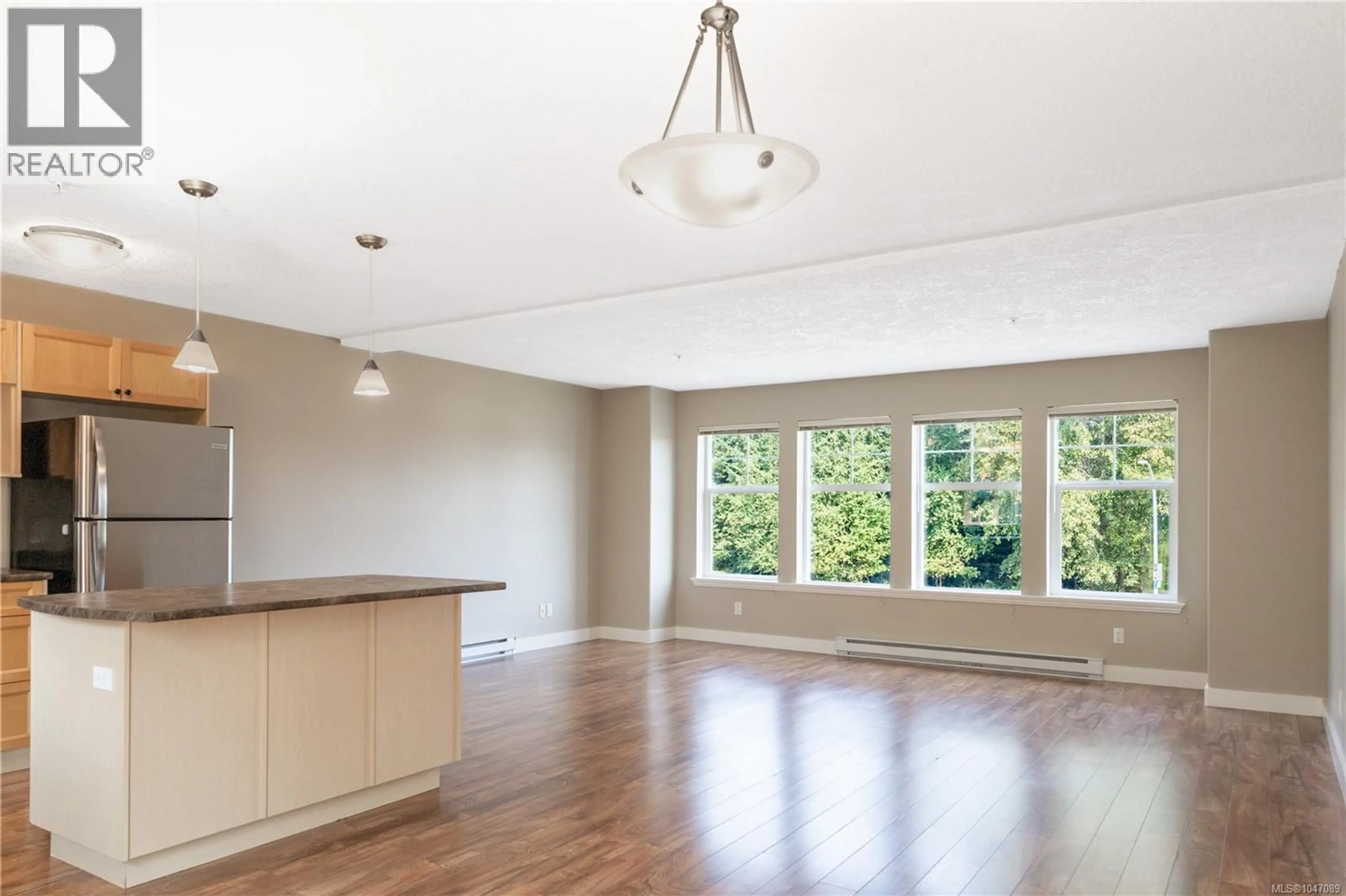 Open concept kitchen, wood/laminate floor for 101 - 701 HILCHEY ROAD, Campbell River British Columbia V9W0A2