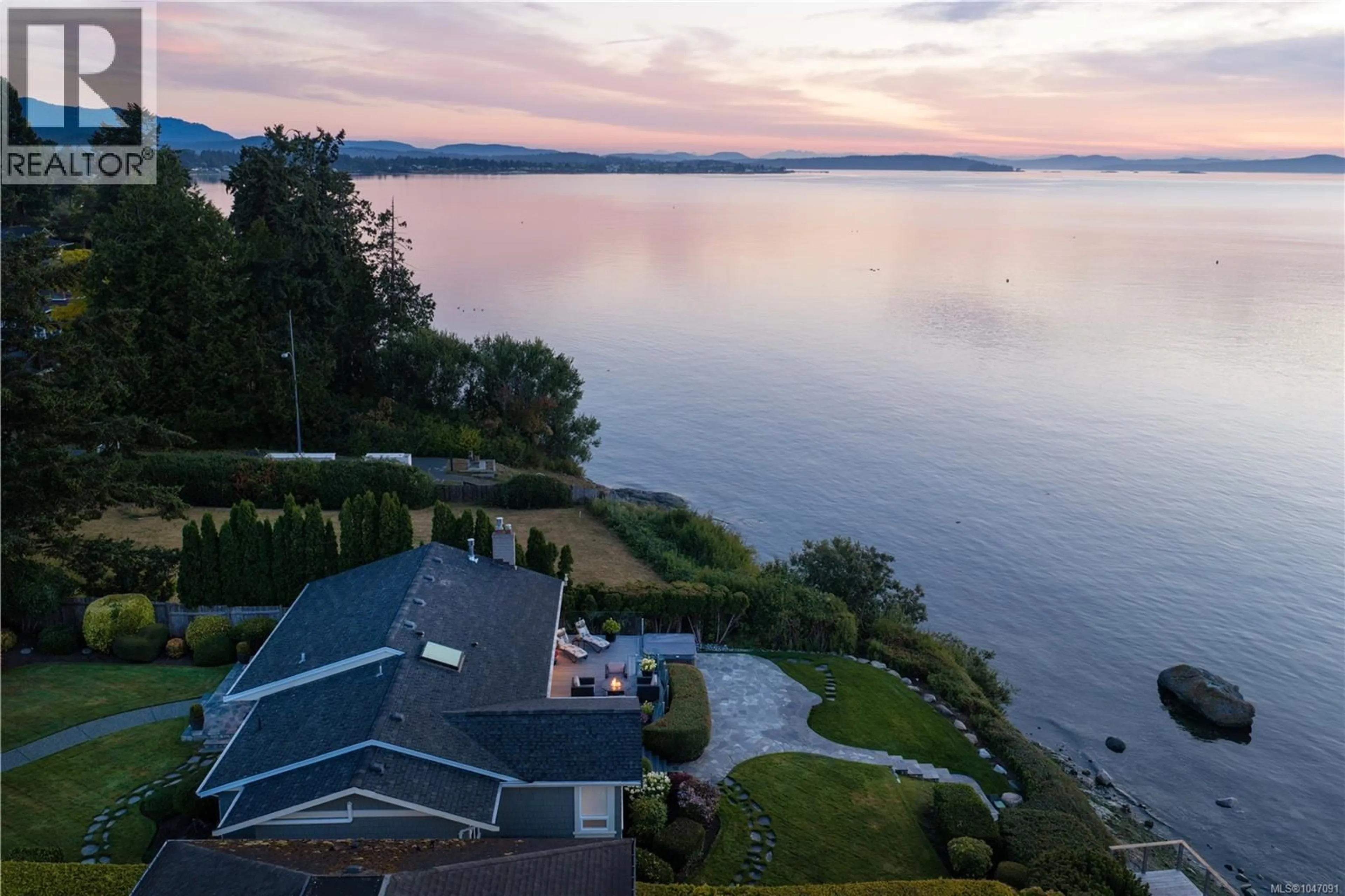 A pic from outside/outdoor area/front of a property/back of a property/a pic from drone, water/lake/river/ocean view for 8585 LOCHSIDE DRIVE, North Saanich British Columbia V8L1M5